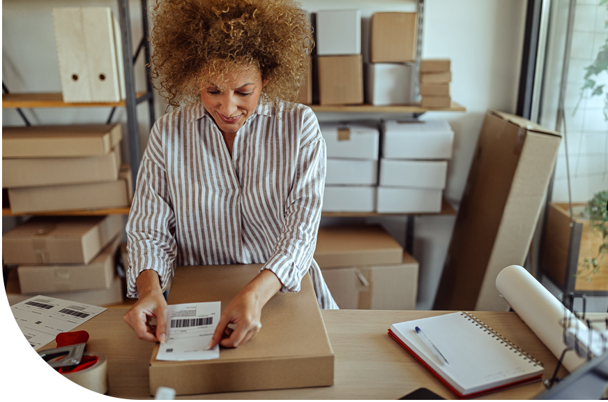 Business owner packaging goods to sell