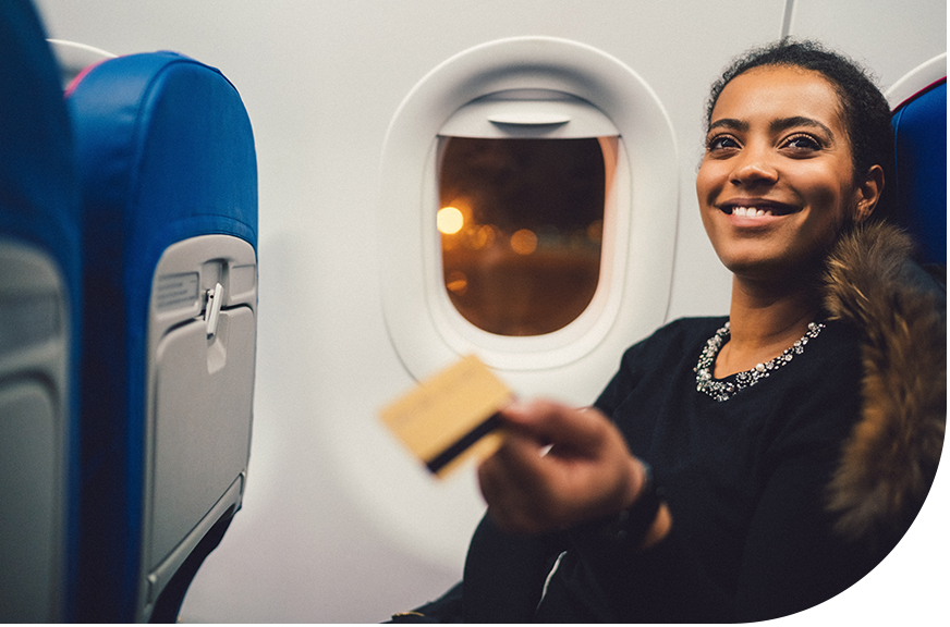 cross-channel consistency for airline and travel industry from Shift4 passenger paying for a drink on a plane