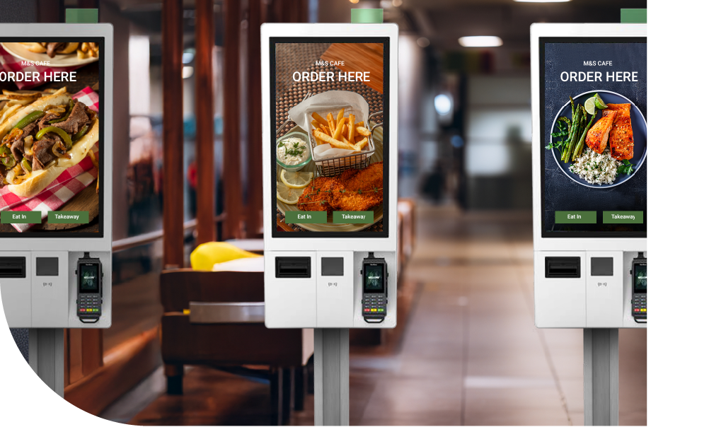 Three kiosks side by side in a restaurant - Shift4 Kiosk