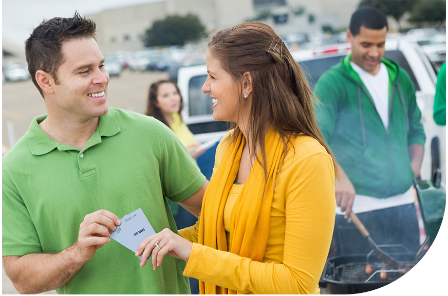 couple leaving parking lot after paying at event