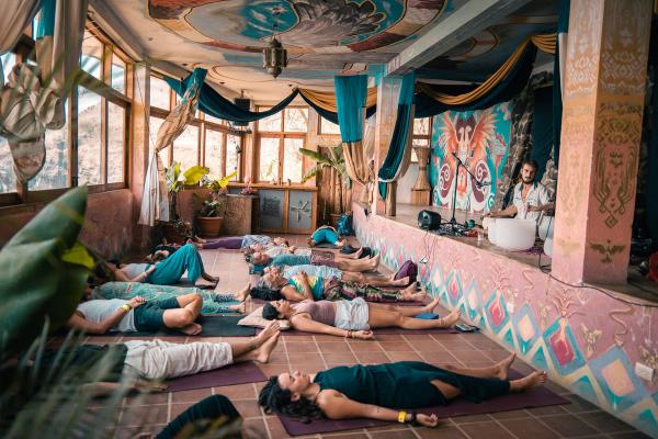 A group class in savasana at the Eagle’s Nest shala