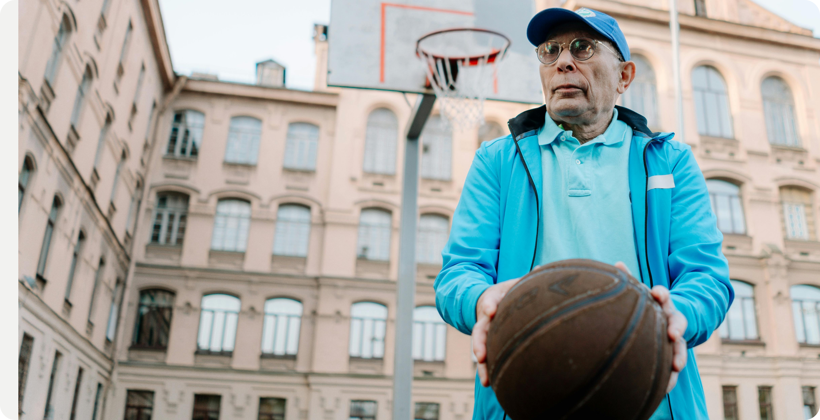 Older person playing basketball