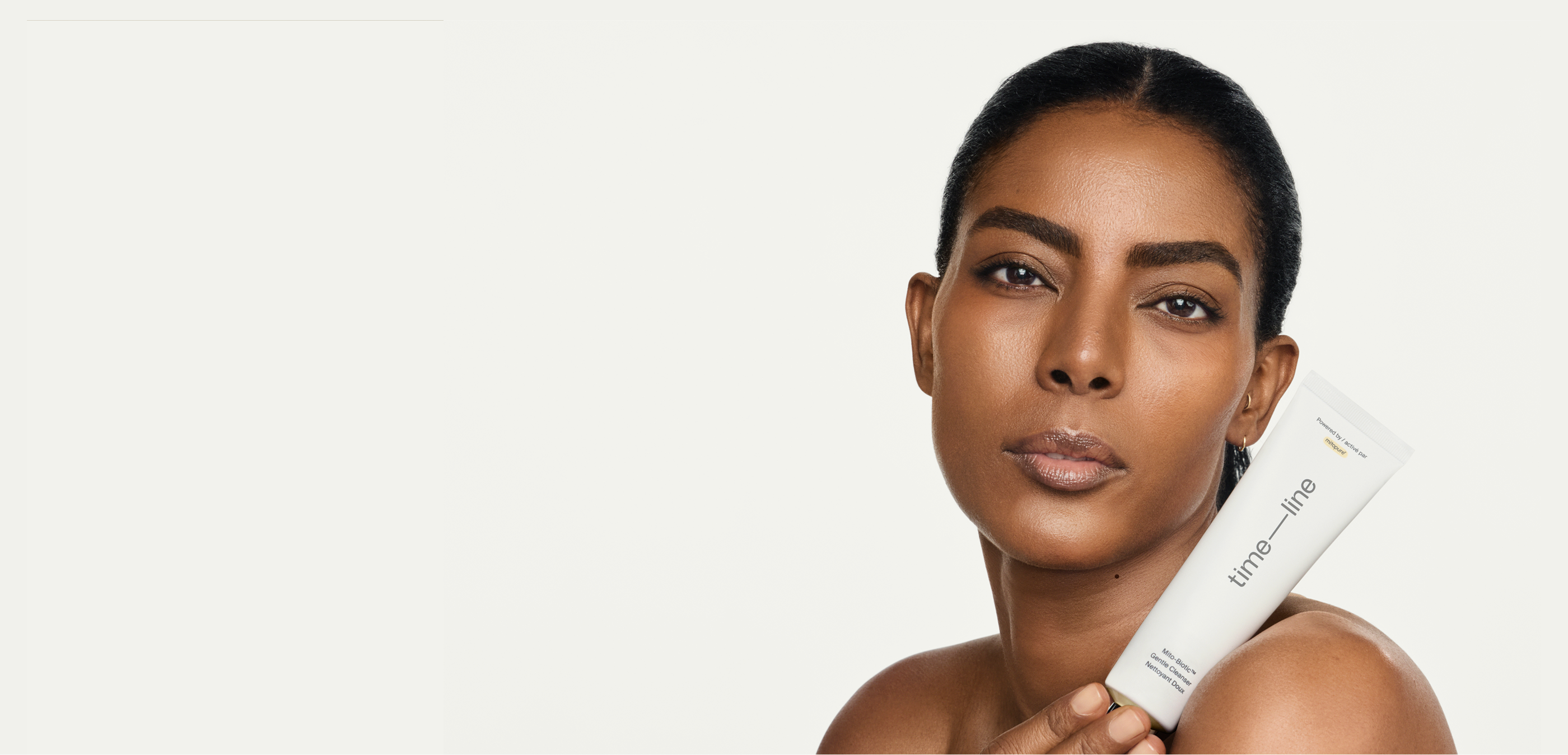 Woman holding Mitopure Gentle Cleanser
