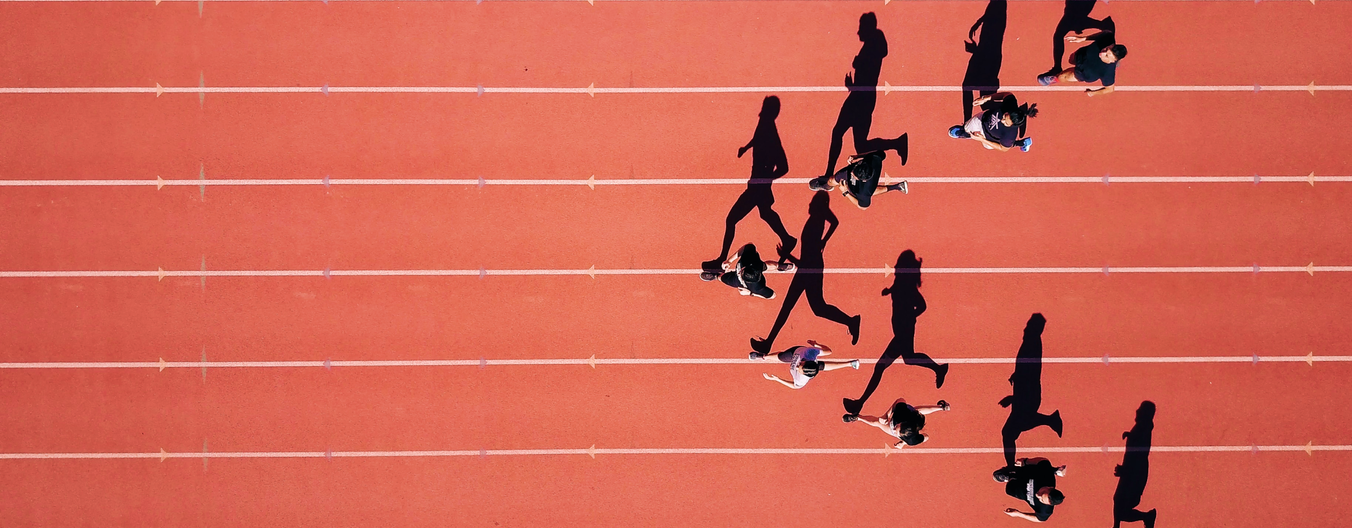People running on a sports track