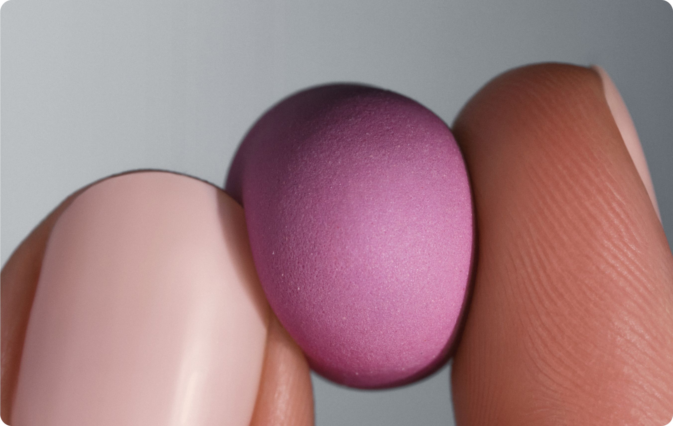 woman holding a Urolithin A gummy