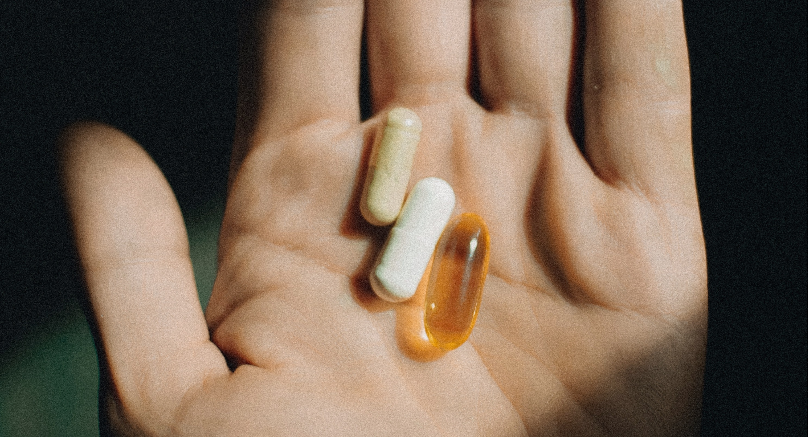 Hand holding pills