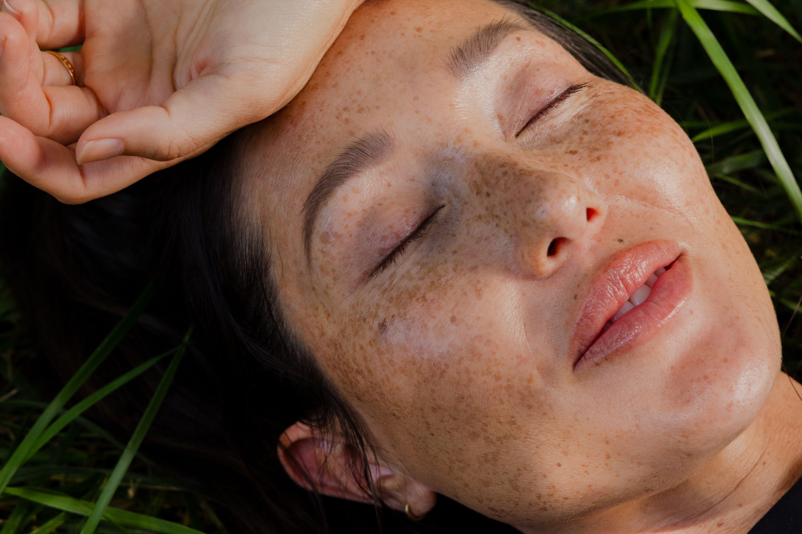 Woman lying in grass 