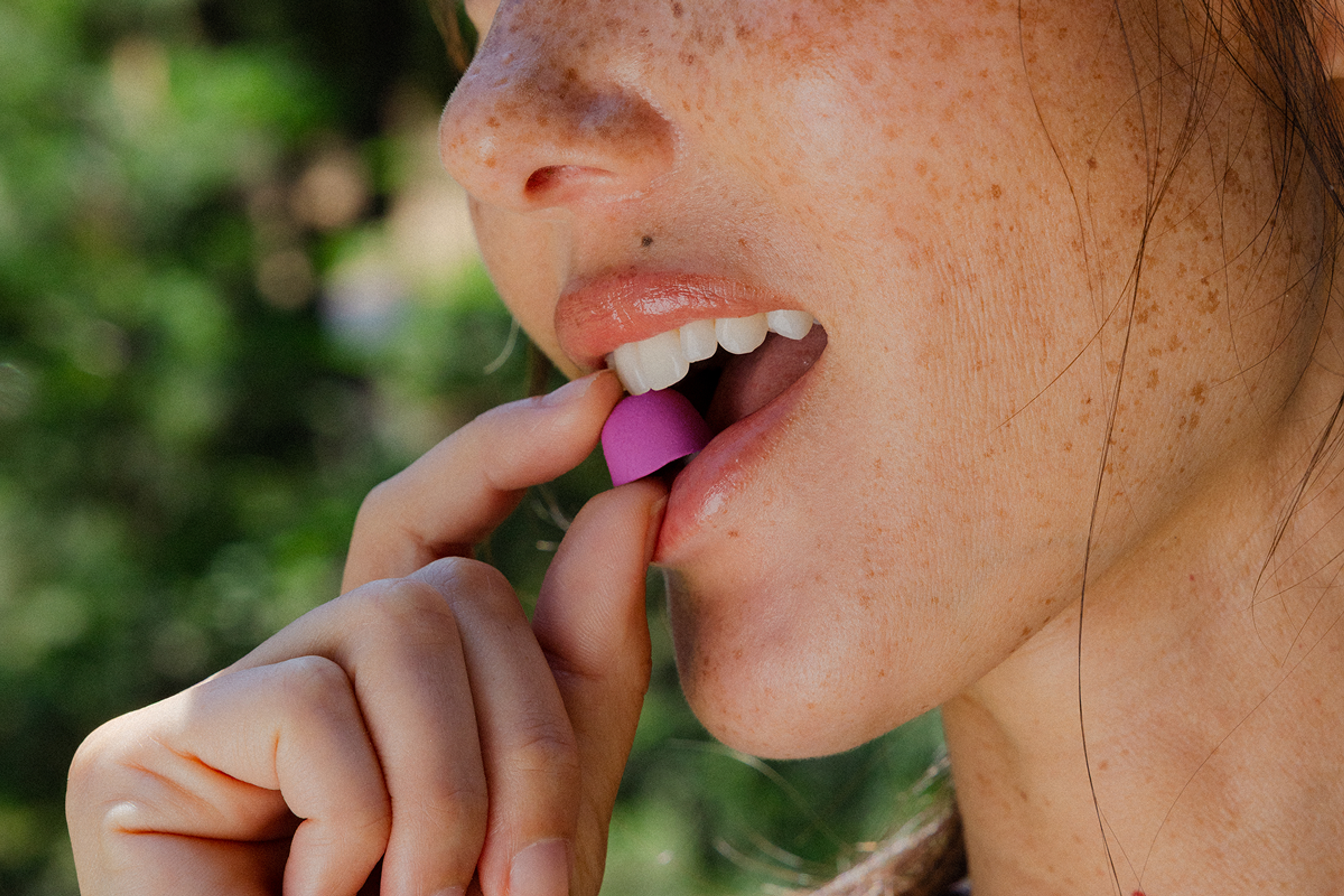 Woman eating Mitopure Gummies