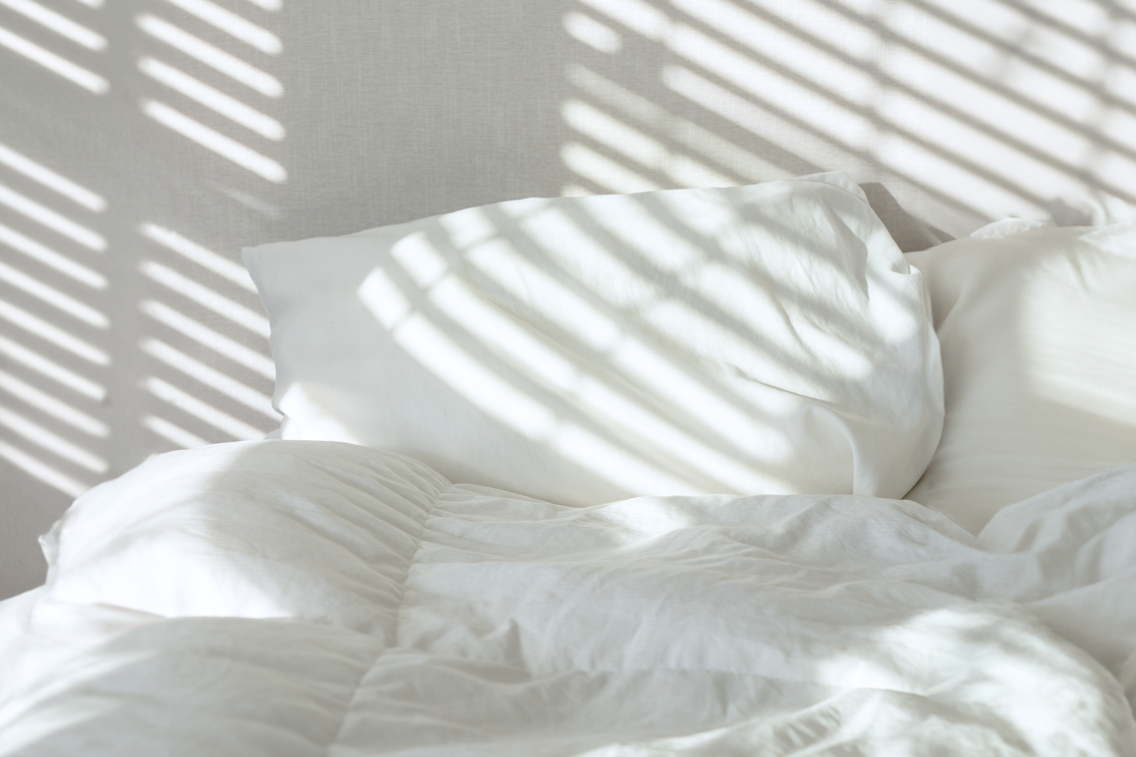 Bed and pillow with morning light