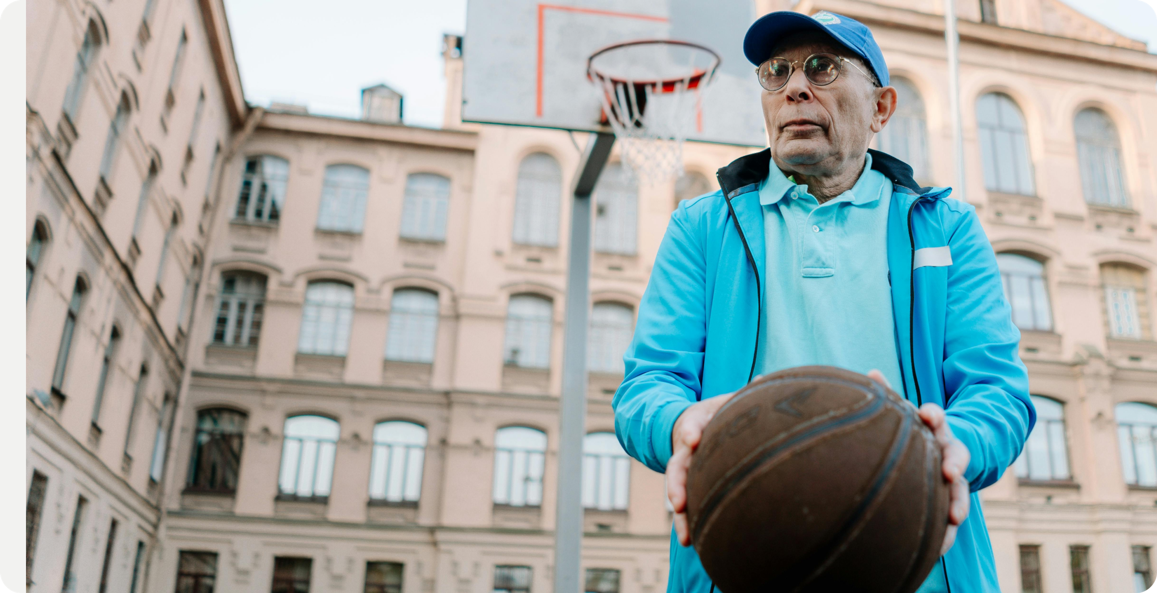 Older person playing basketball