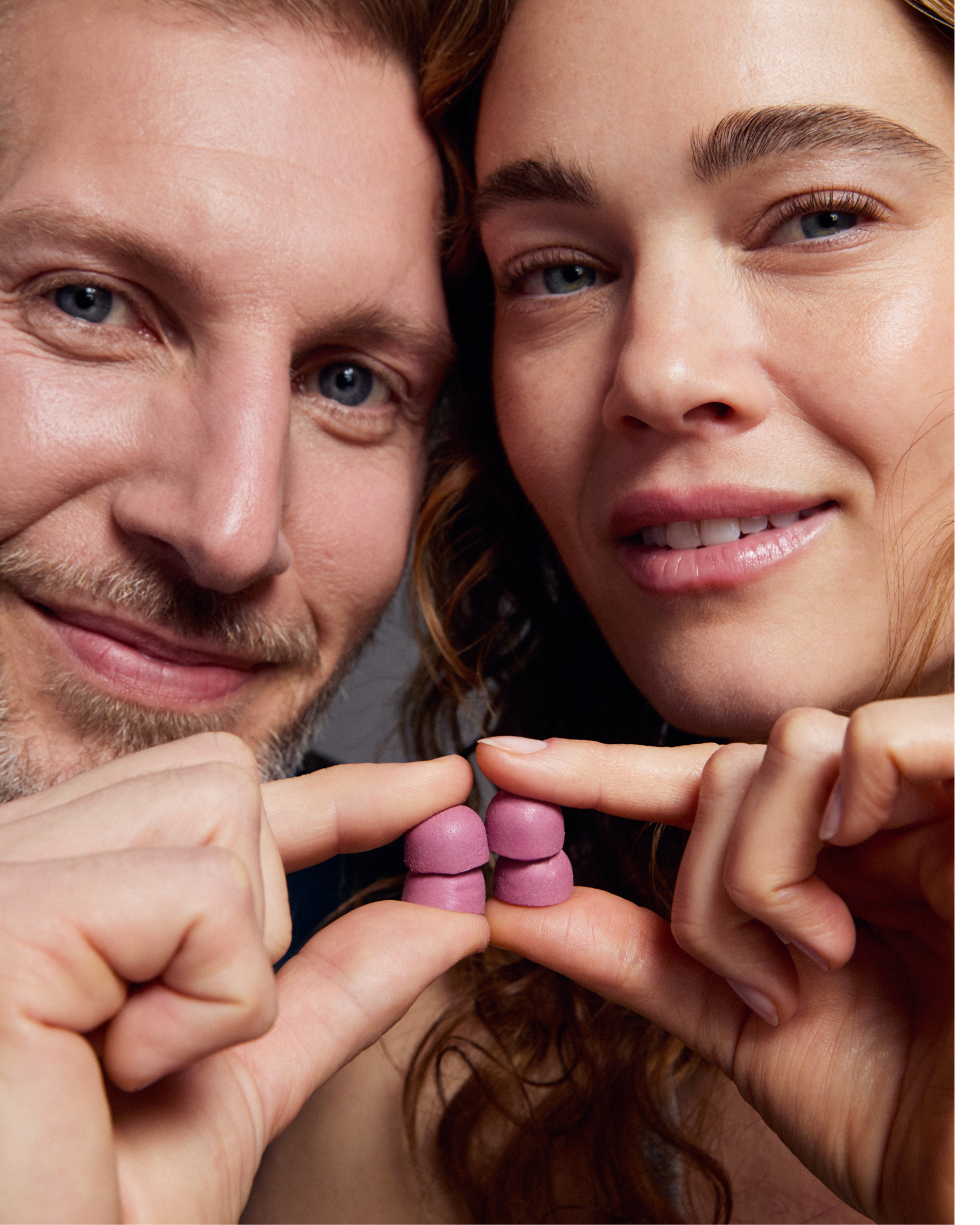 Man and woman holding Mitopure Gummies