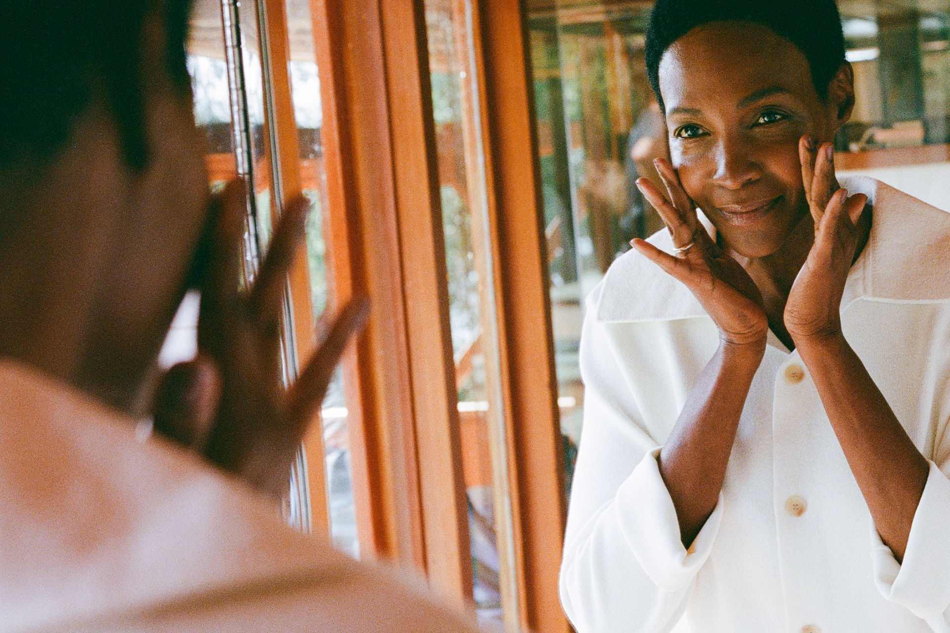 Image of woman looking in mirror