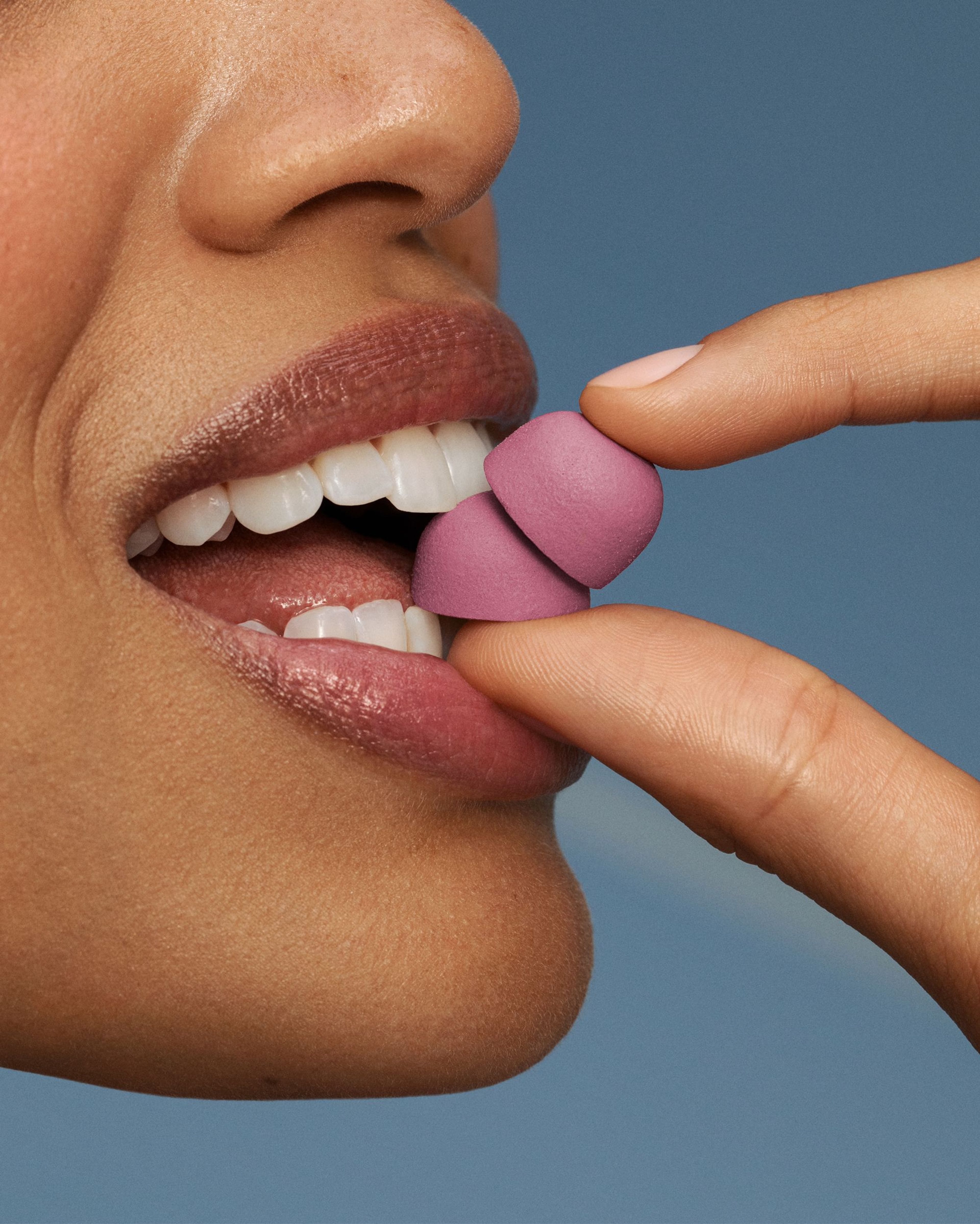 Woman eating Mitopure Gummies