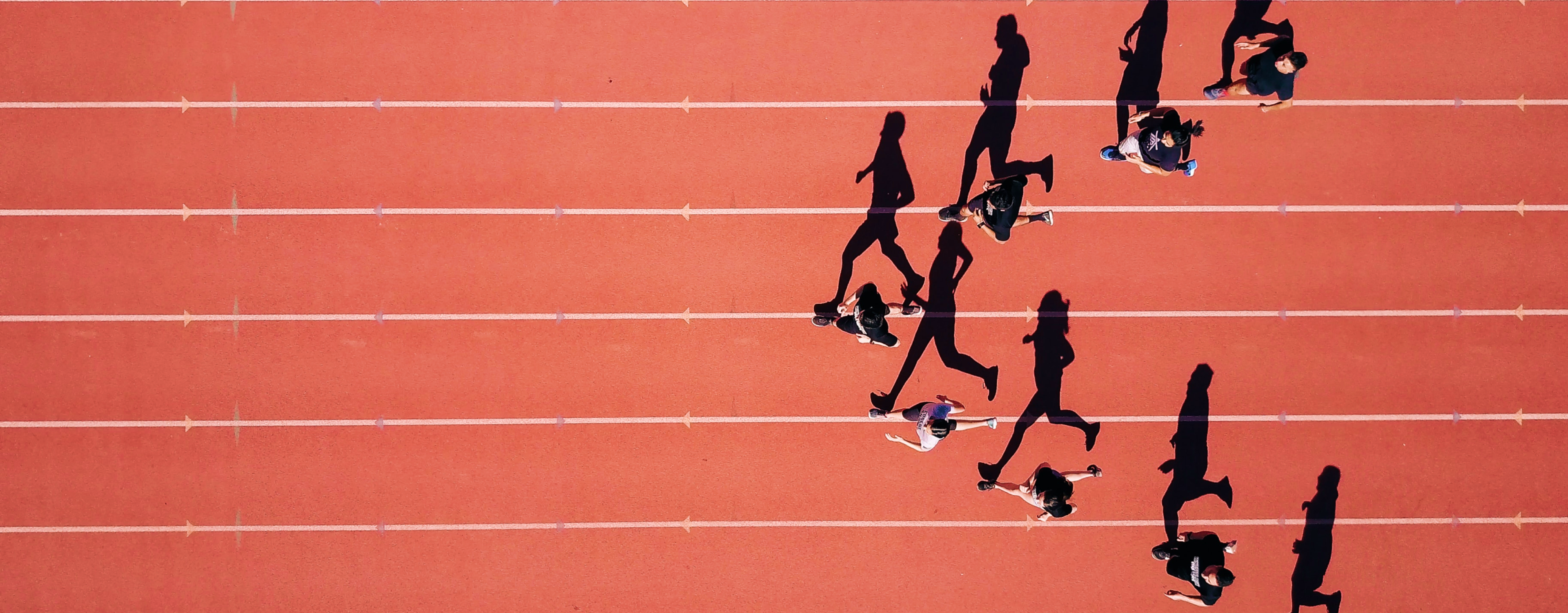 People running on a sports track