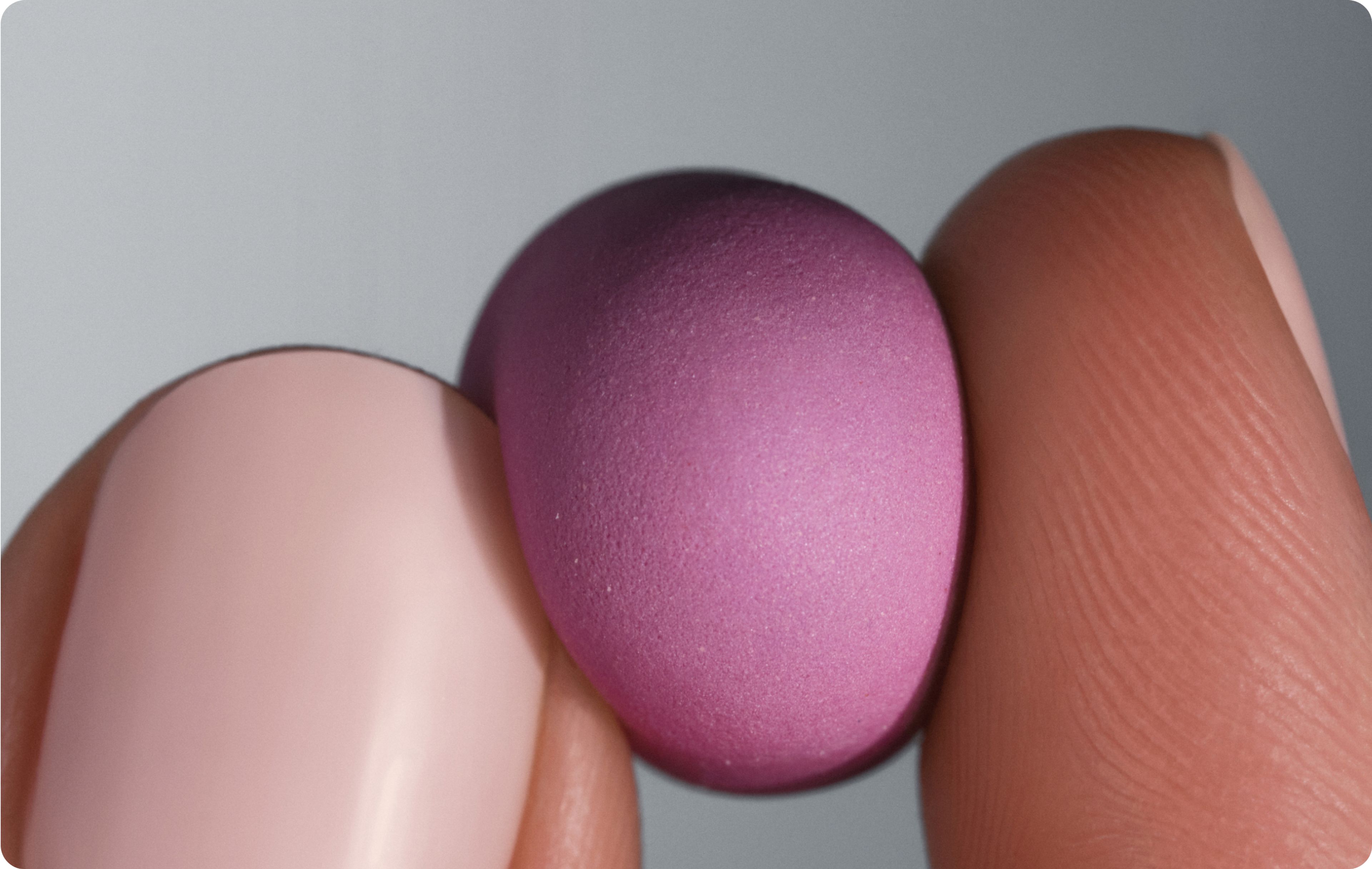 woman holding a Urolithin A gummy