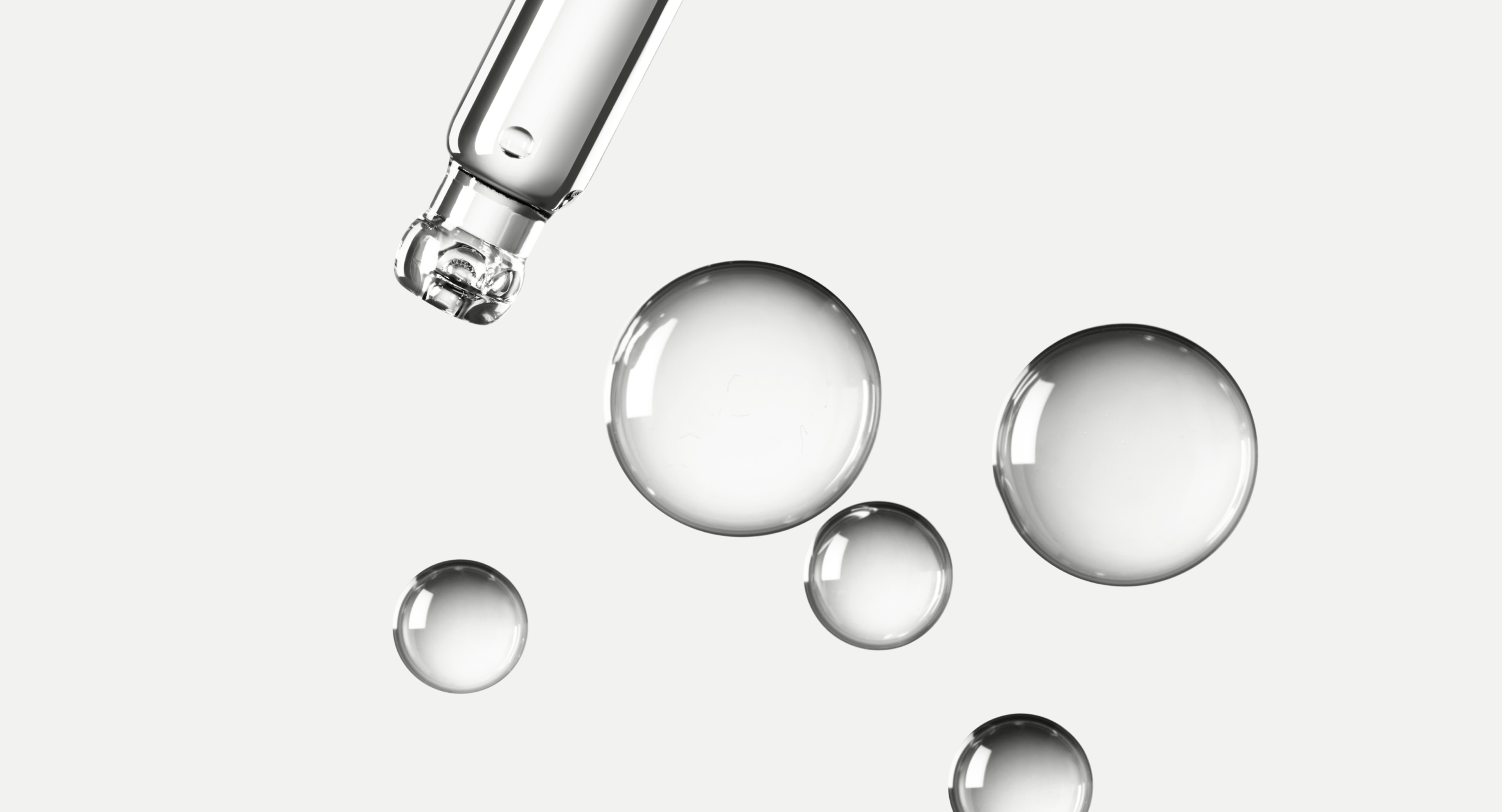 Drops of liquid coming out of a pipette
