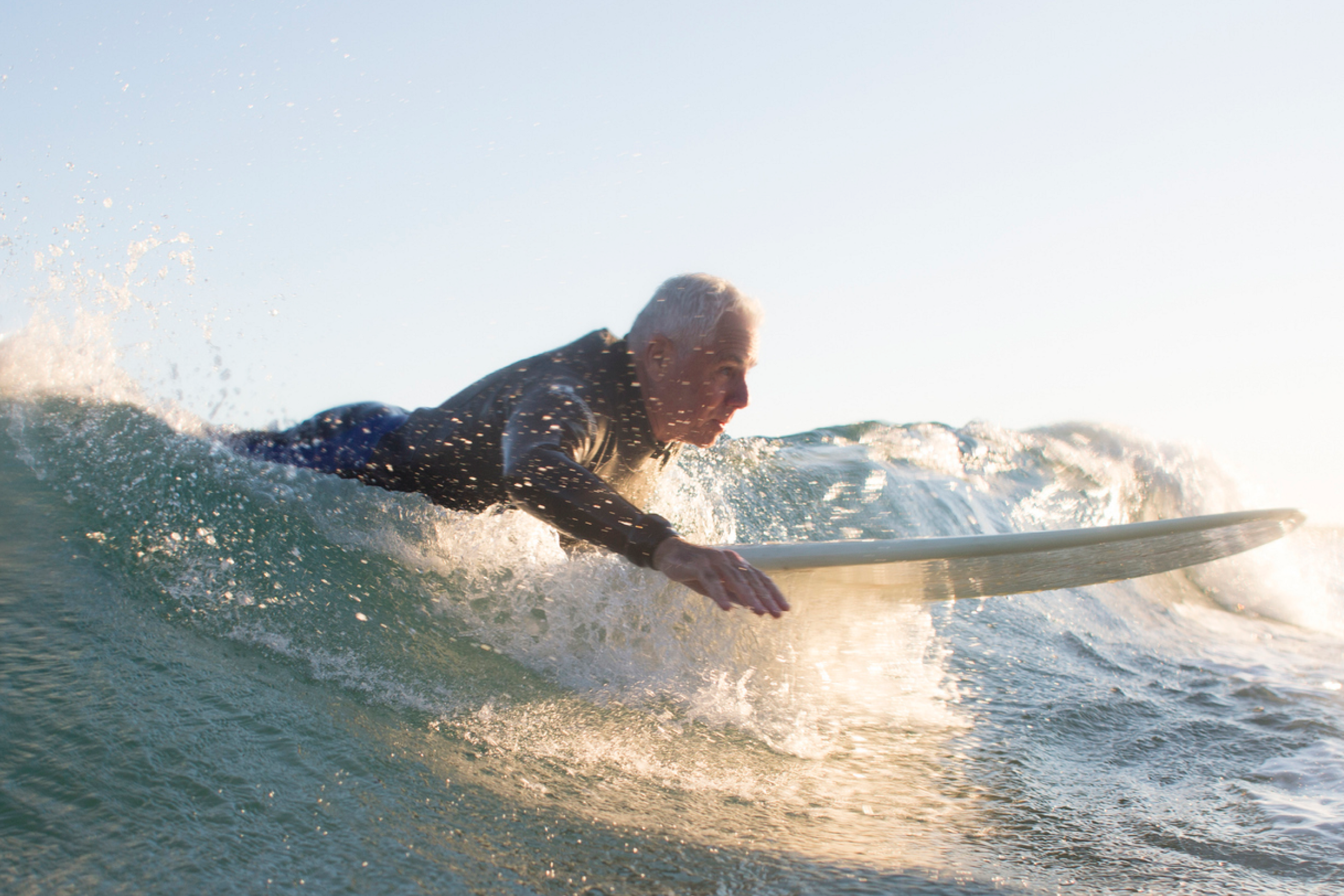 Elder man surfing