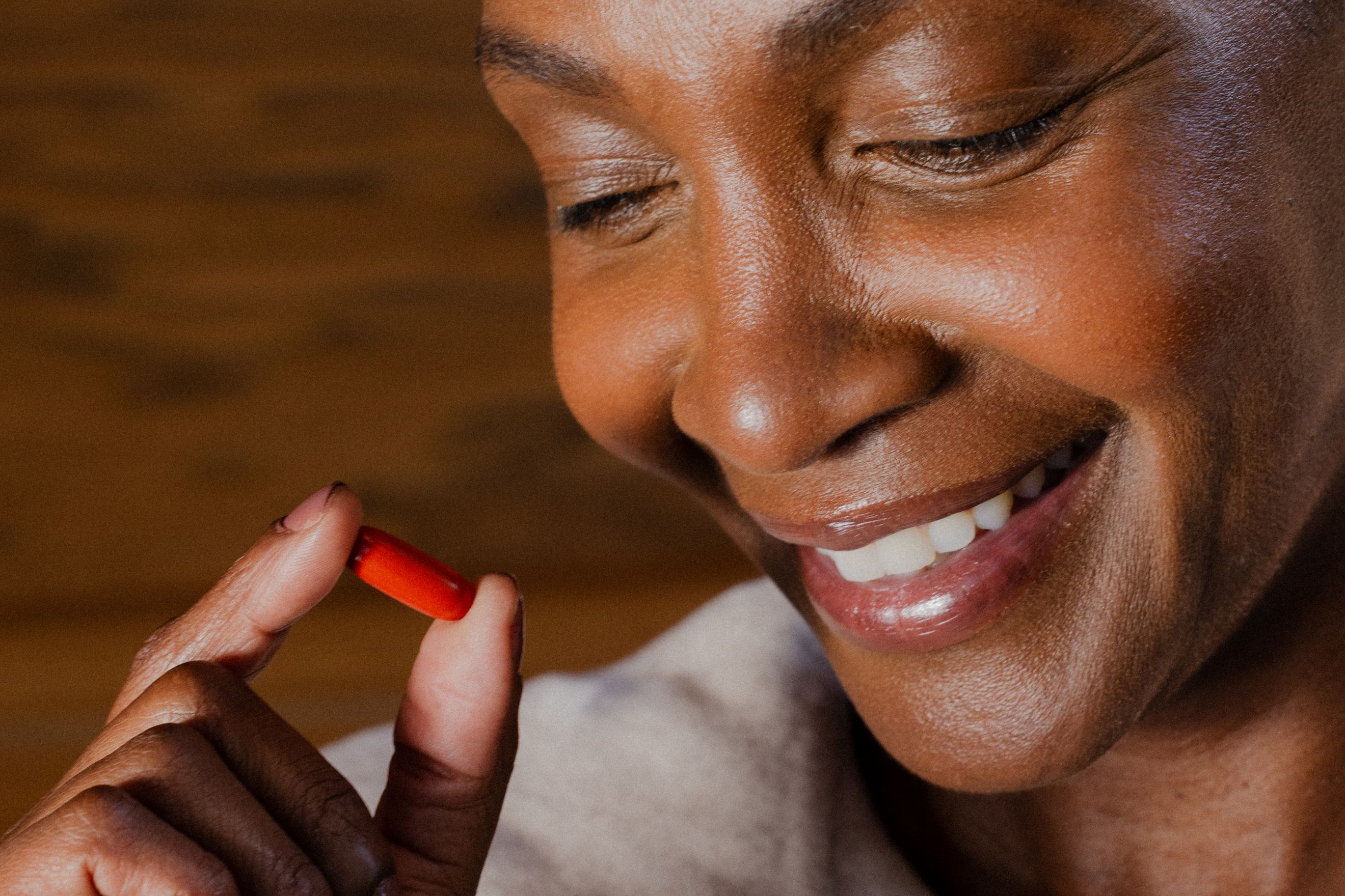Smiling woman with Mitopure Softgel