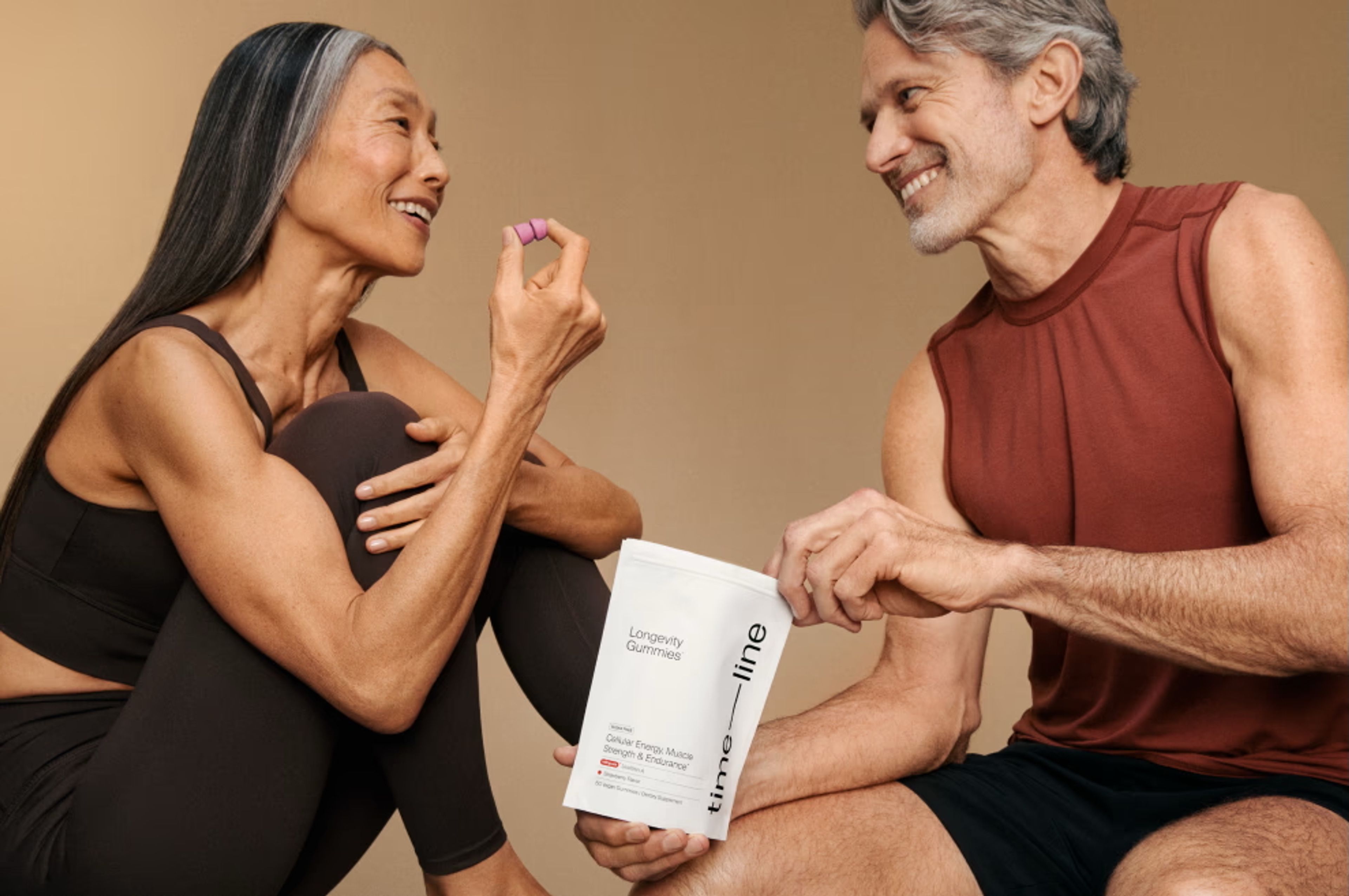 Woman and man tasting Urolithin A gummies