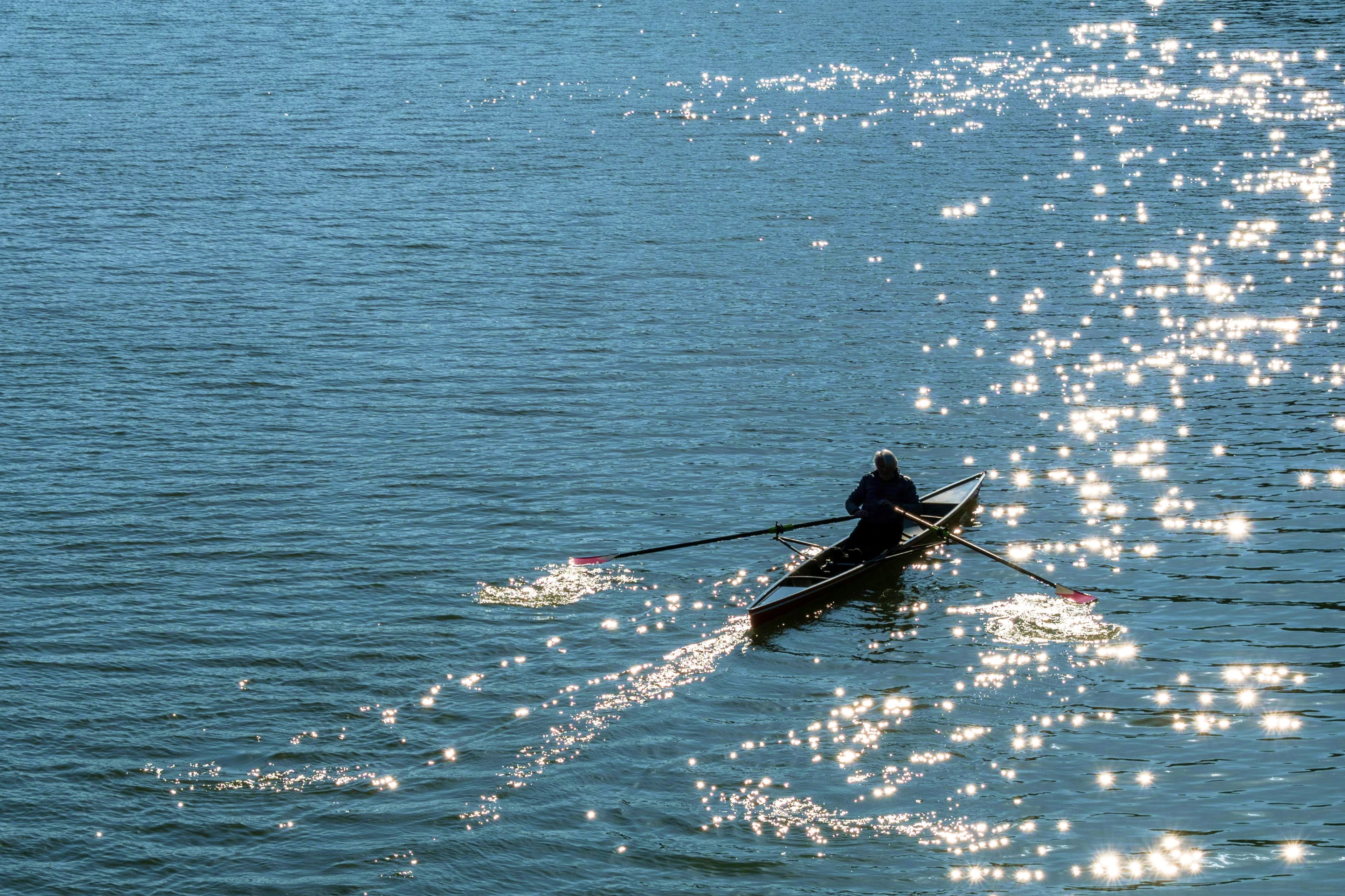 Person kayaking in summer weather