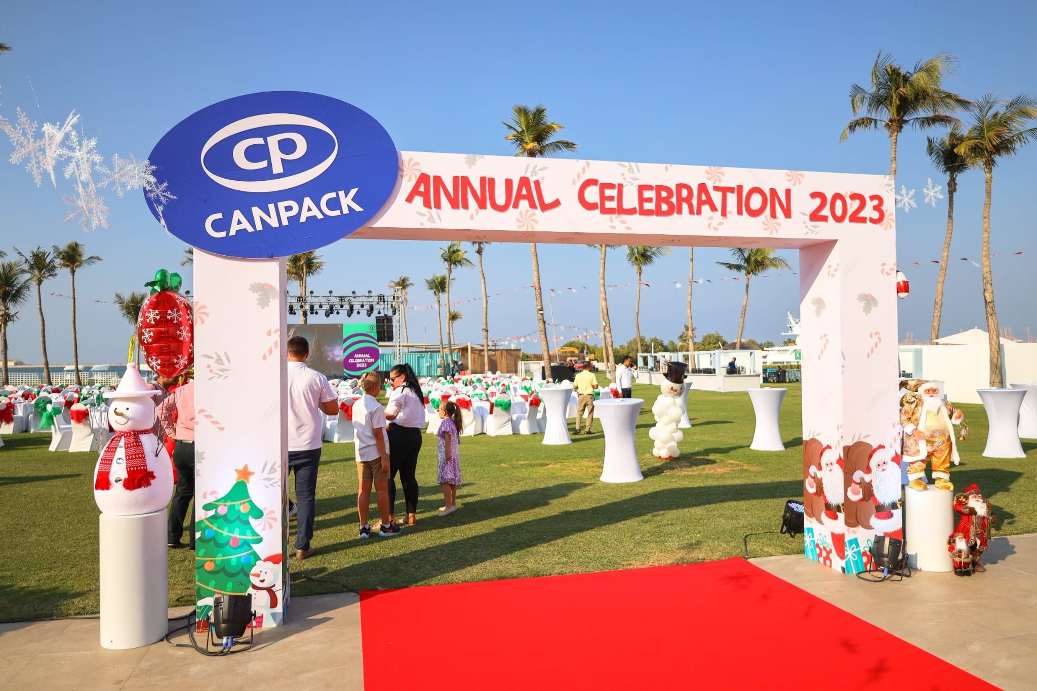 CANPACK Annual Celebration 2023 entrance arch with red carpet and Christmas decor
