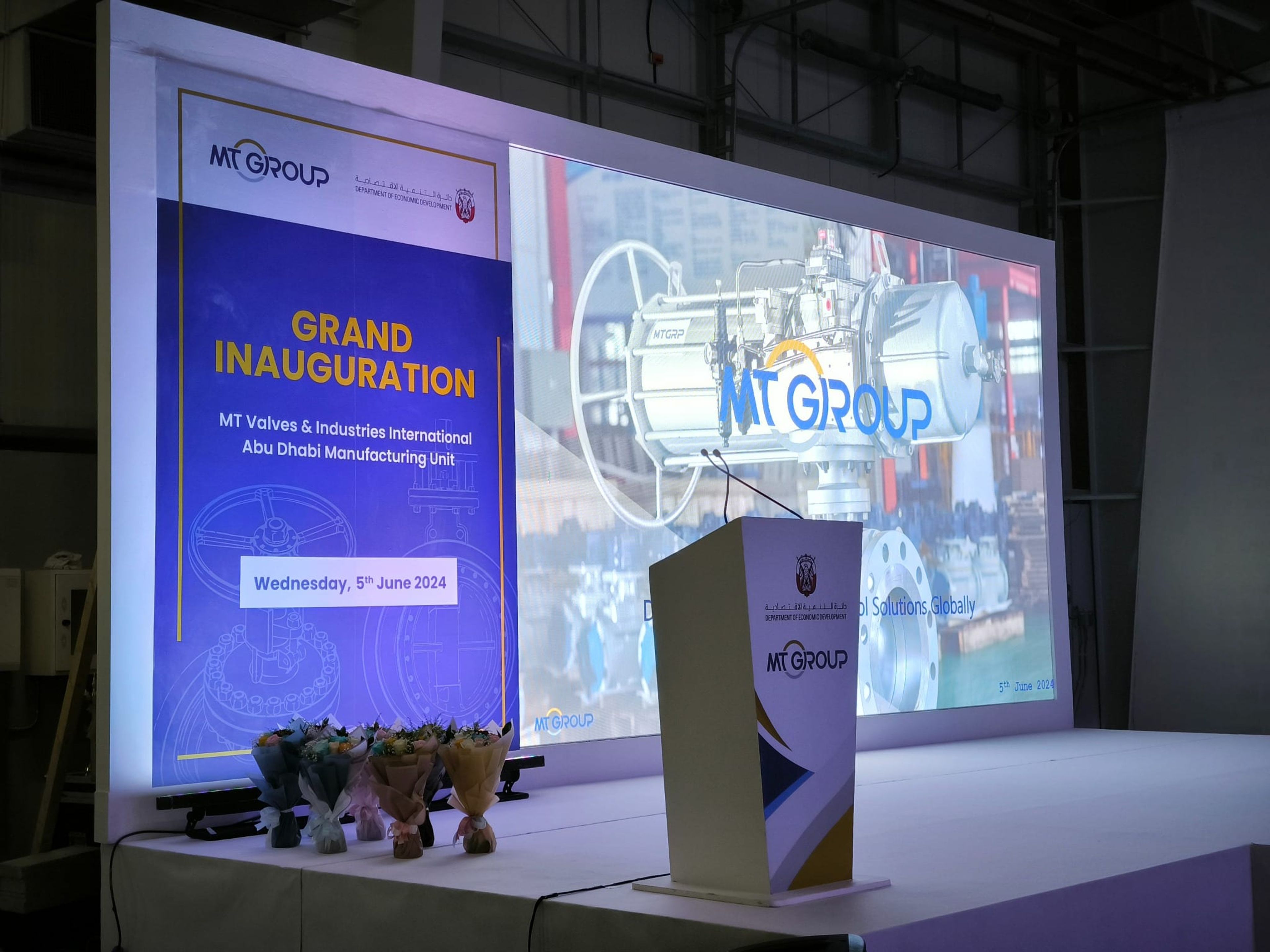 MT Group grand inauguration stage with LED screen and branded lectern