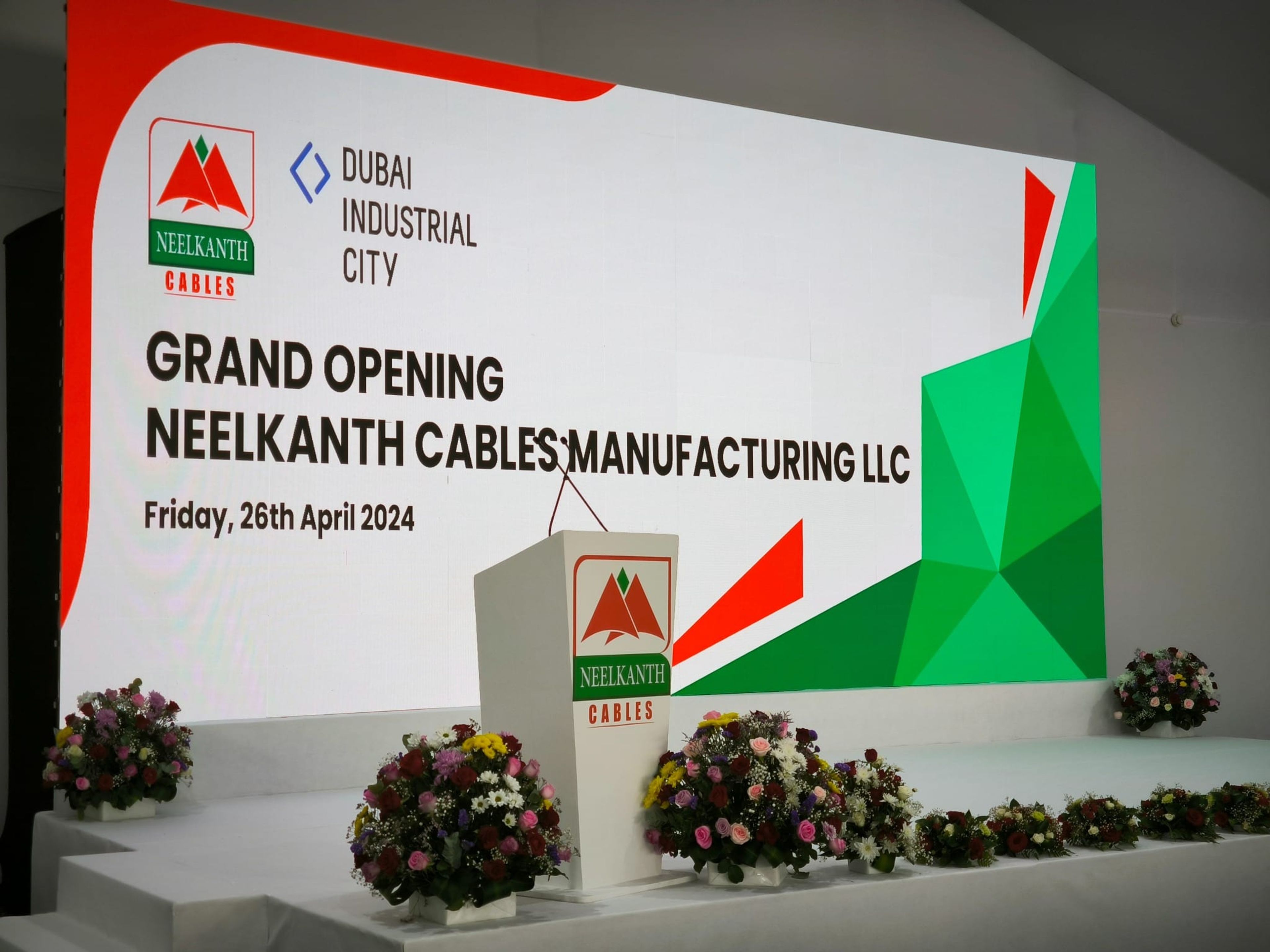 Grand Opening Neelkanth Cables Manufacturing LLC stage screen, dated 26 April 2024