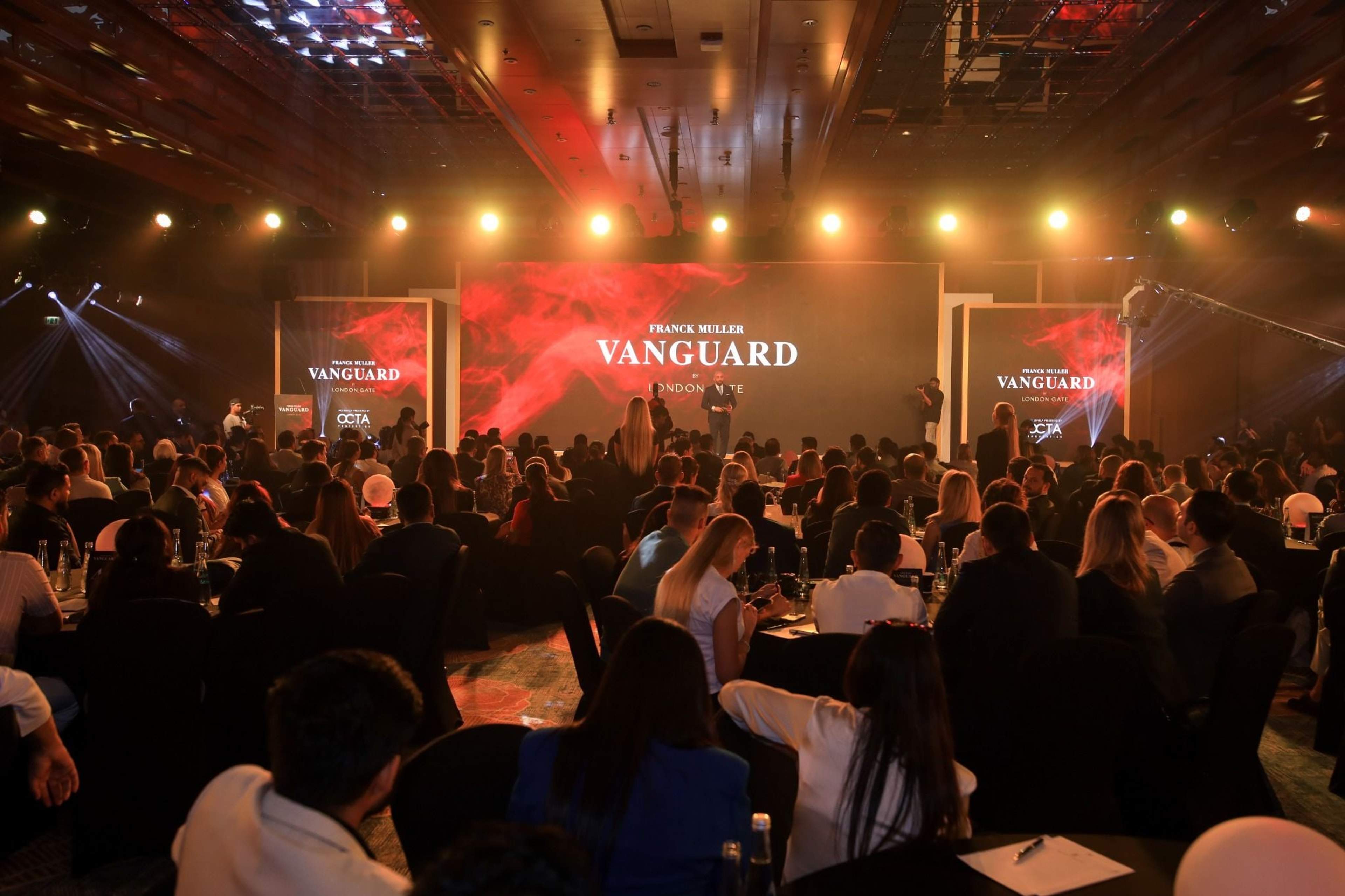 Packed room facing the Franck Muller Vanguard launch stage under warm lighting, The Ritz-Carlton DIFC