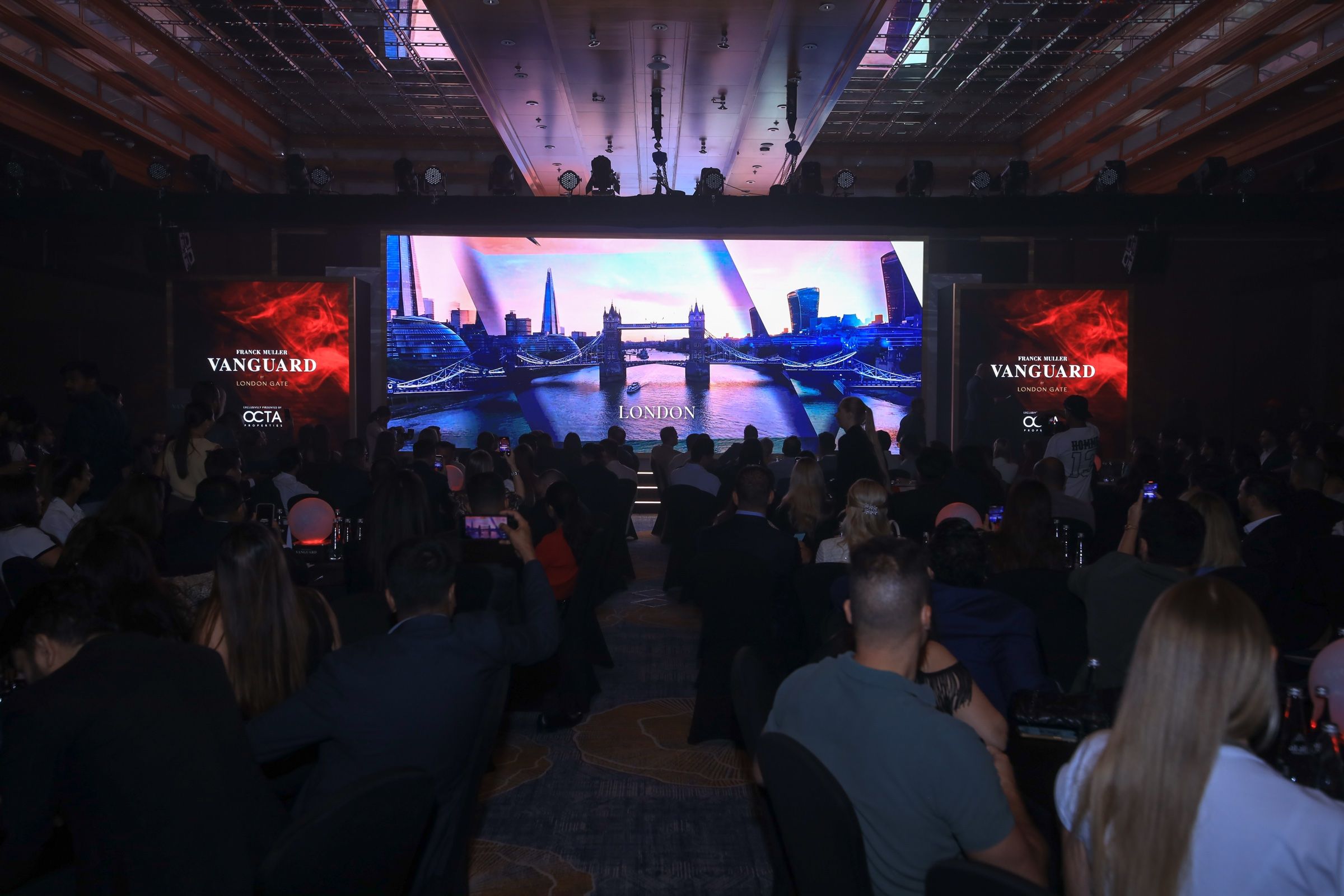 Vanguard Corporate launch event stage featuring immersive LED screens, professional podiums, and dynamic visual elements for audience engagement.