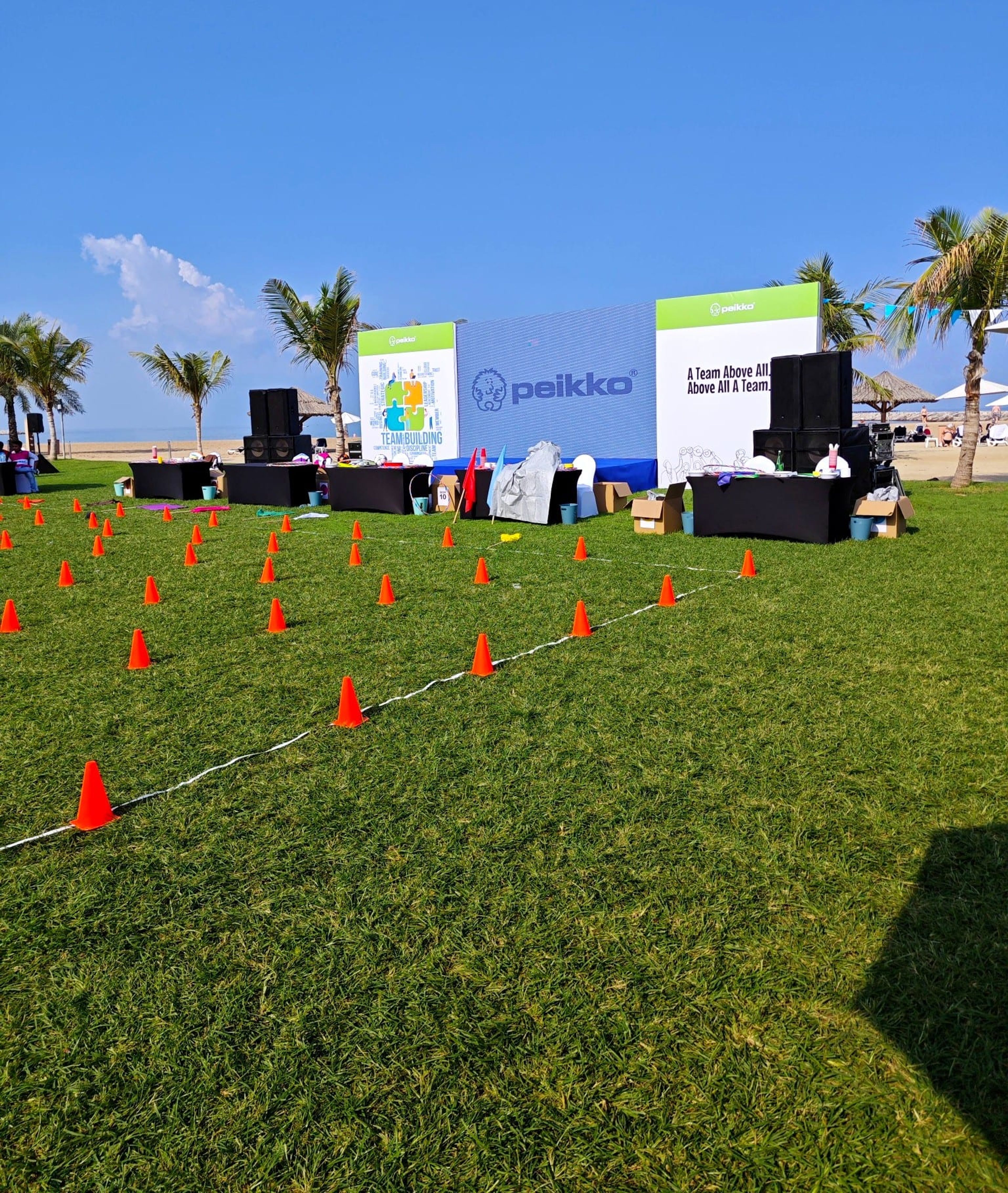 Team building activity course marked with cones in front of the Peikko stage