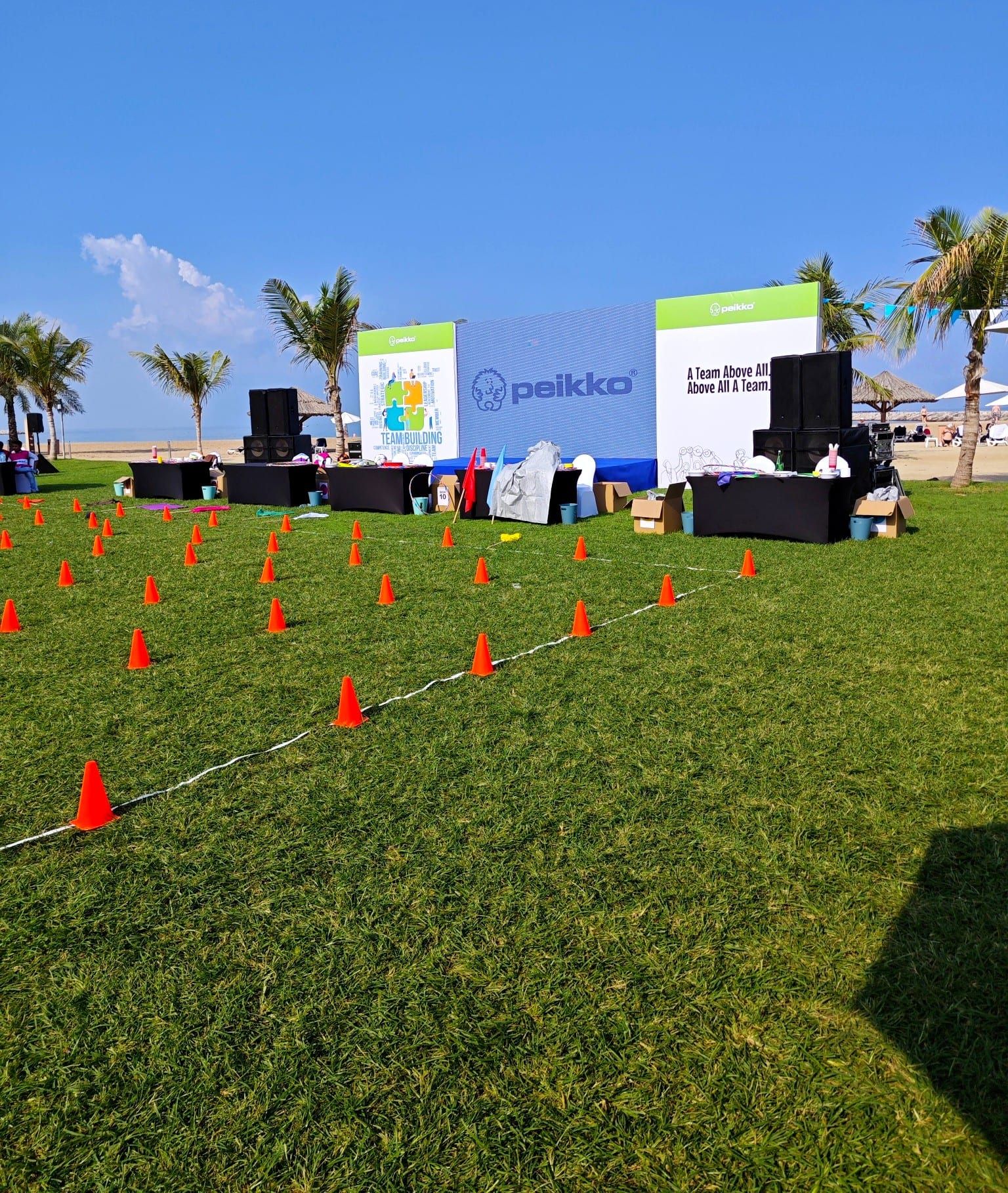Team building activity course marked with cones in front of the Peikko stage