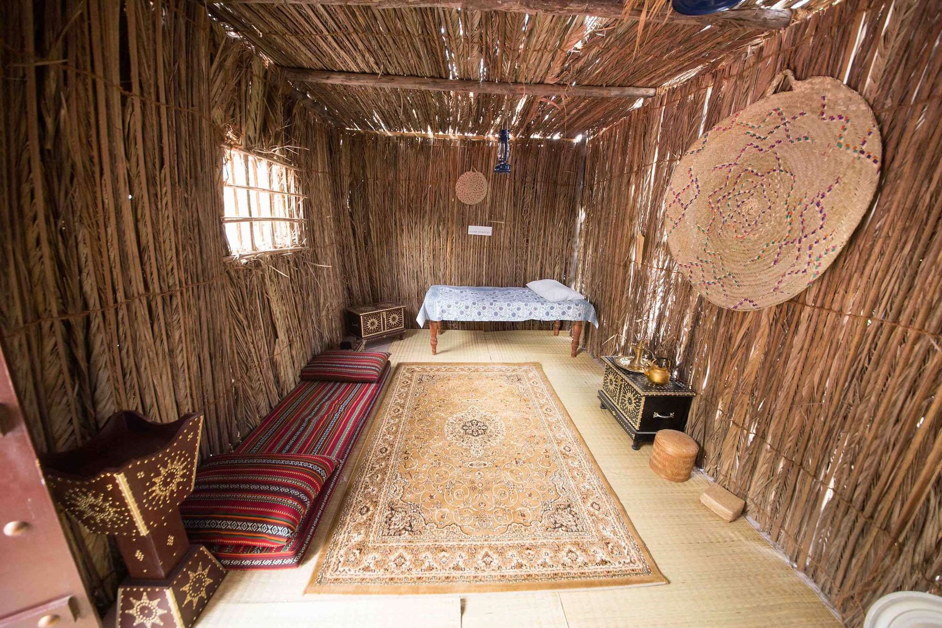 Traditional arish room set up as a majlis with carpets and cushions for a corporate National Day event
