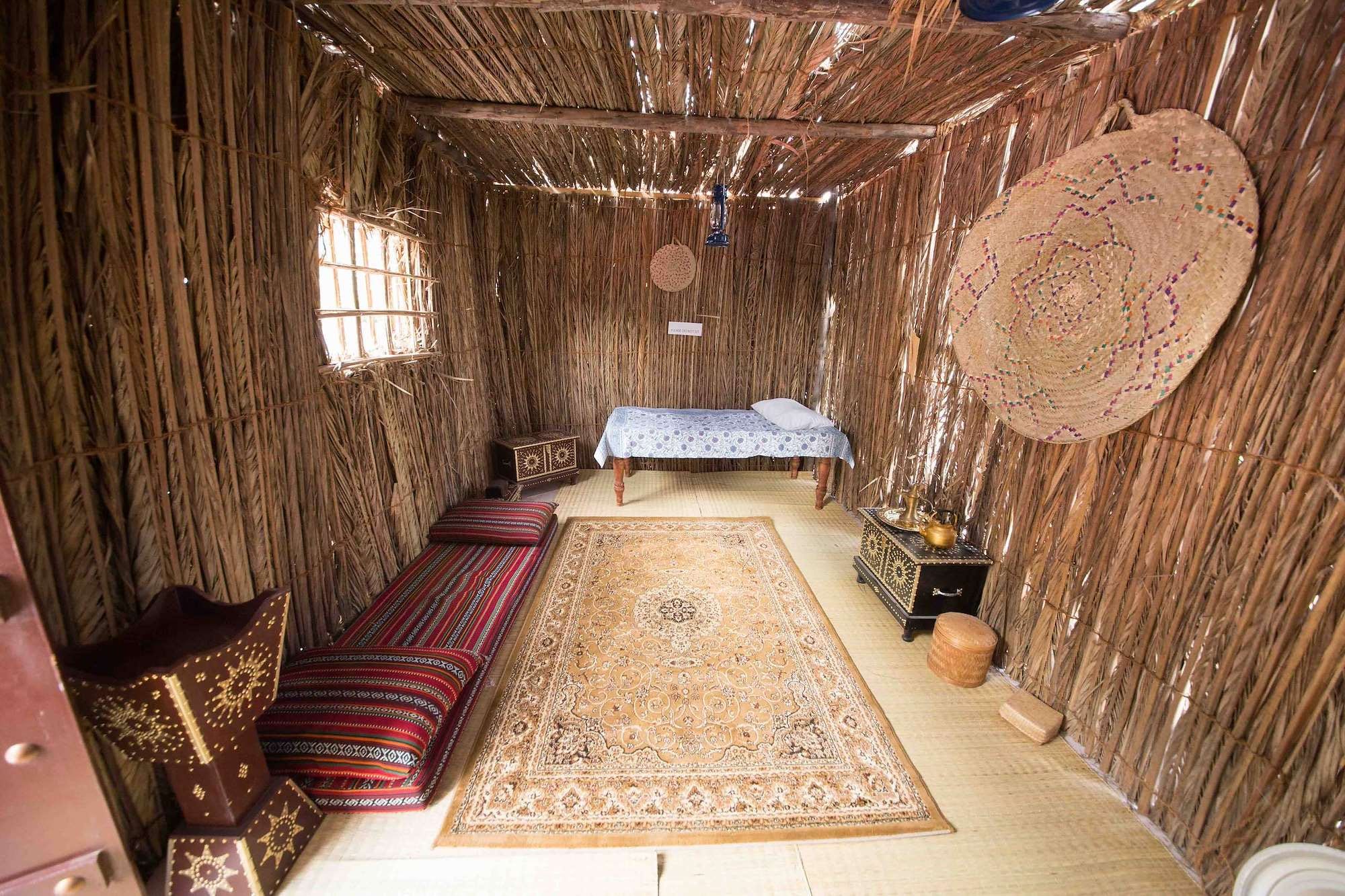 Traditional arish room set up as a majlis with carpets and cushions for a corporate National Day event