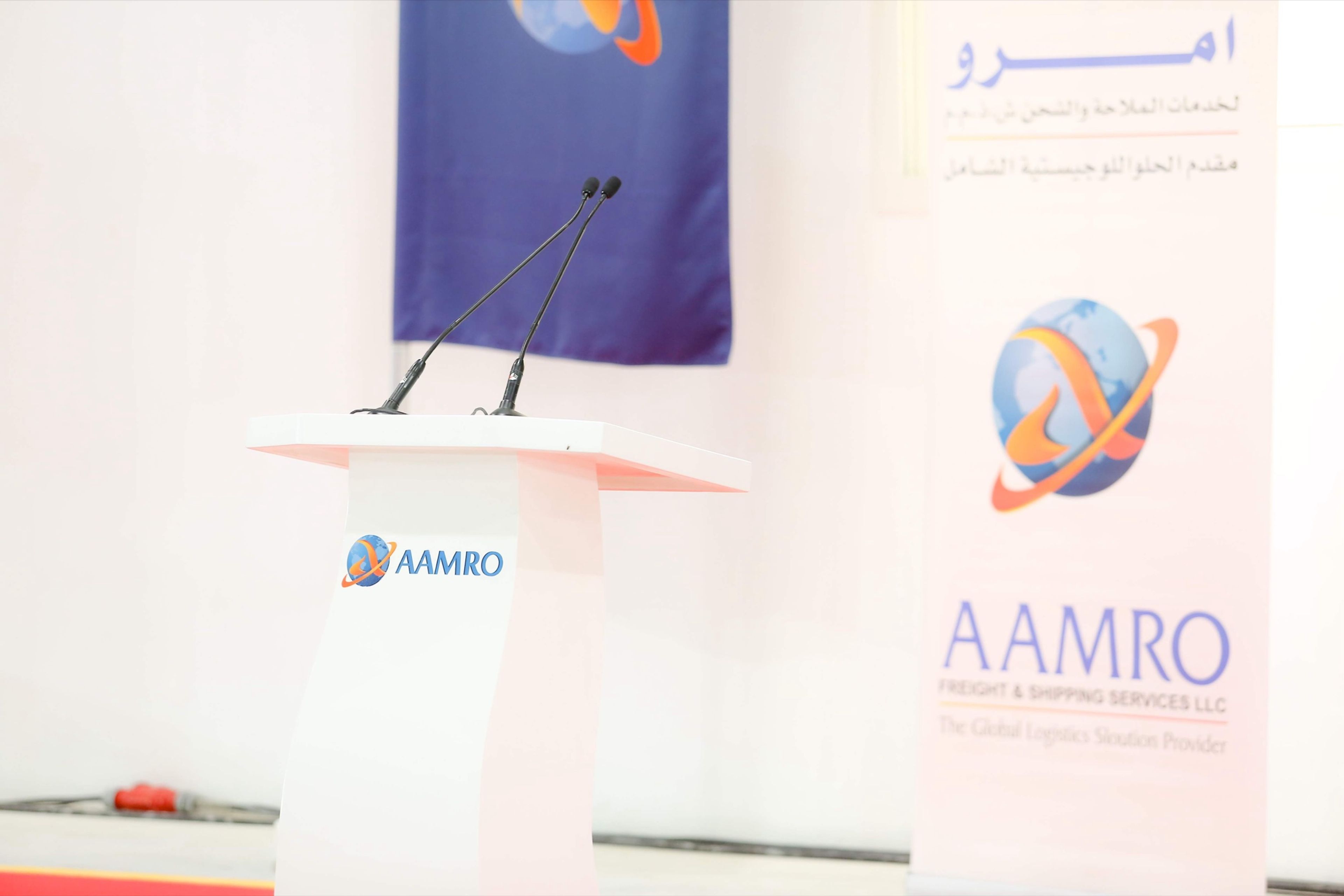 Branded podium and signage at a corporate opening ceremony