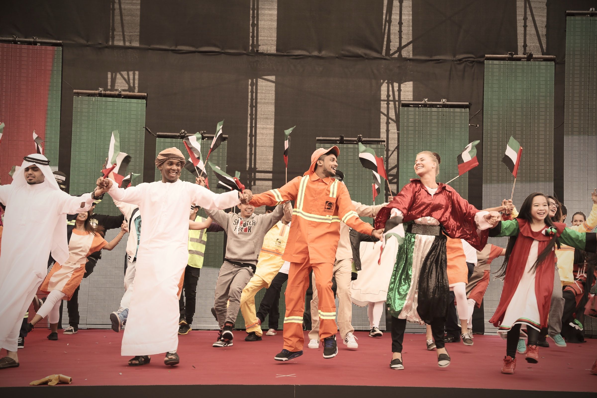 Folk dancers performing in traditional dress at a cultural event
