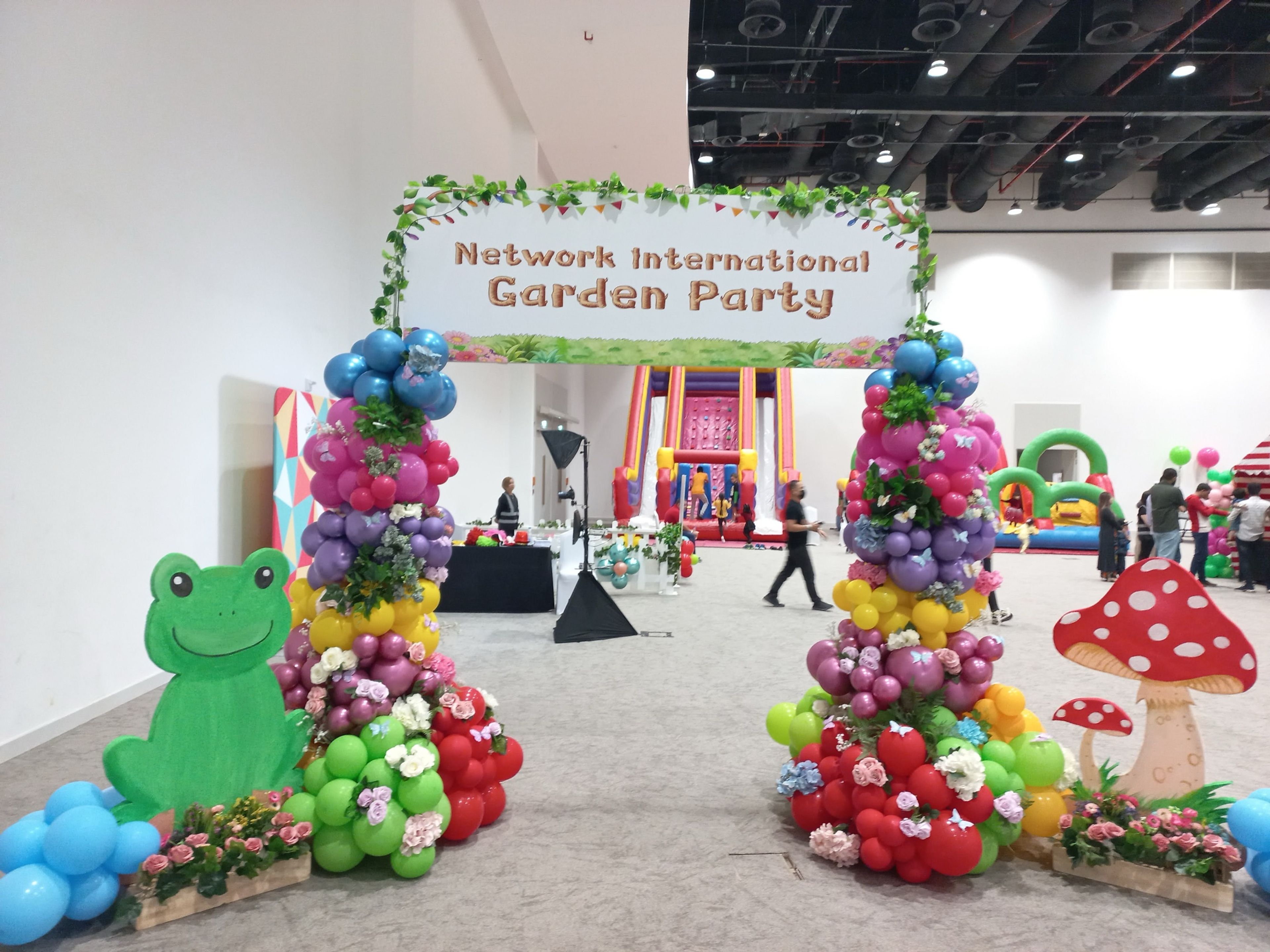 Event organizers analyzing the effectiveness of signage in a corporate event, reviewing feedback and signage examples in a conference room