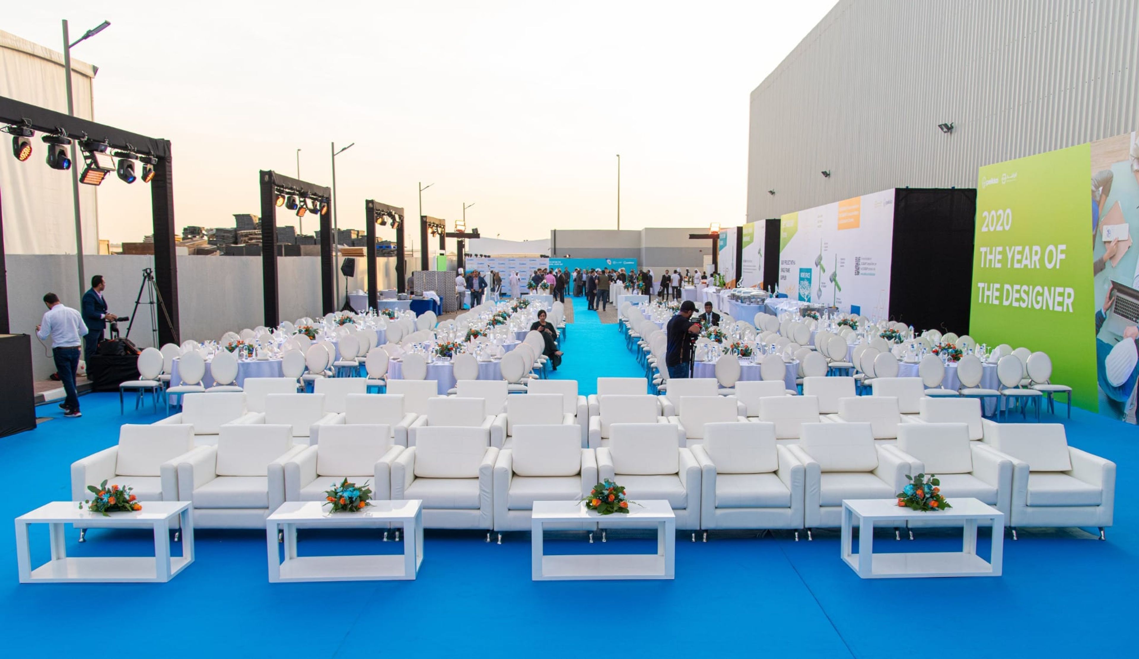 White VIP lounge seating on blue carpet for the Peikko Gulf opening ceremony