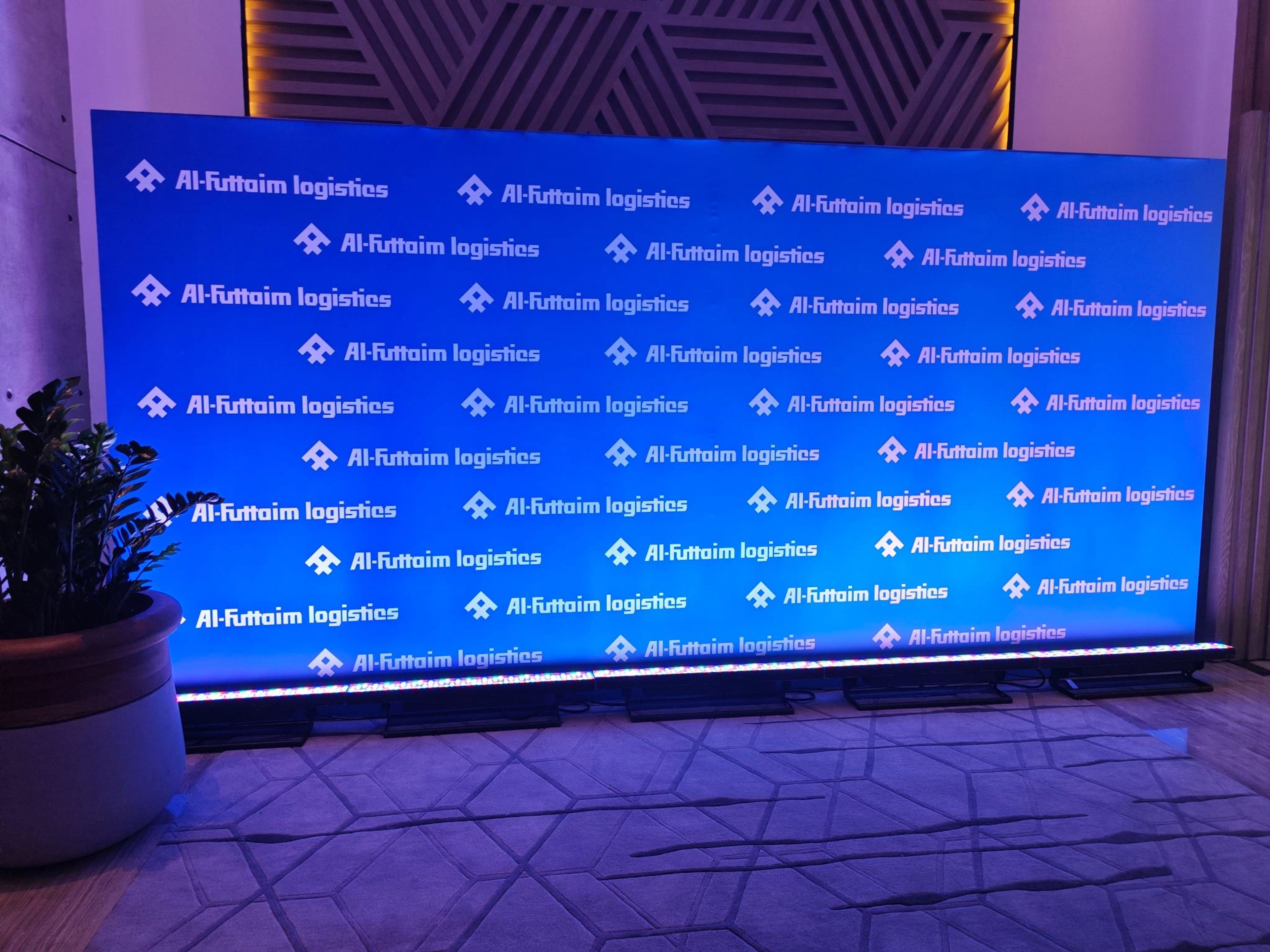 Illuminated Al-Futtaim Logistics step-and-repeat photo wall
