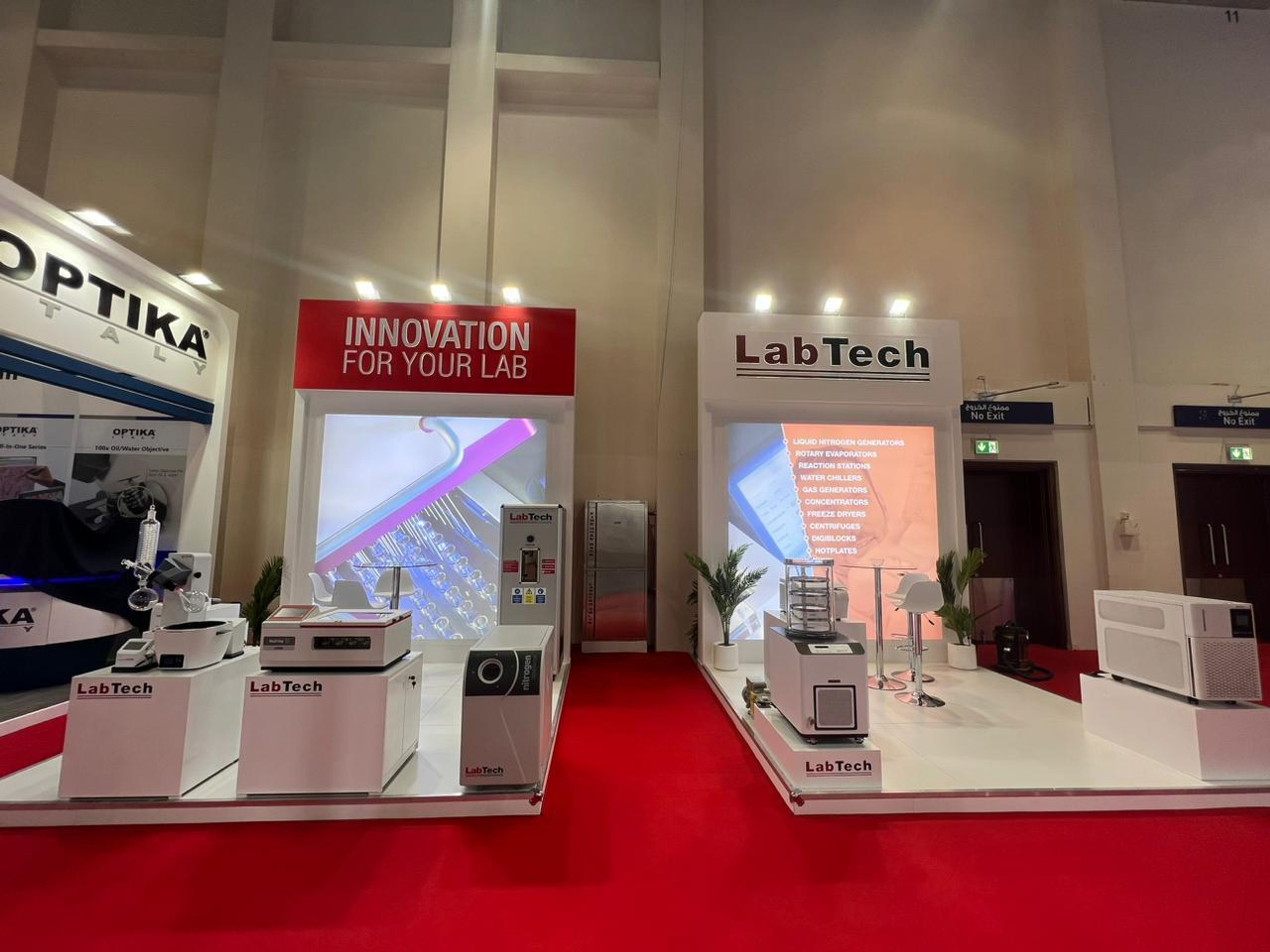 Row of branded exhibition stands in a trade show hall
