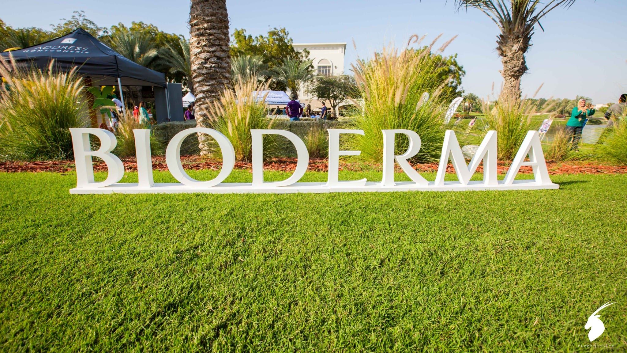 Large freestanding Bioderma letters on the lawn at the family day