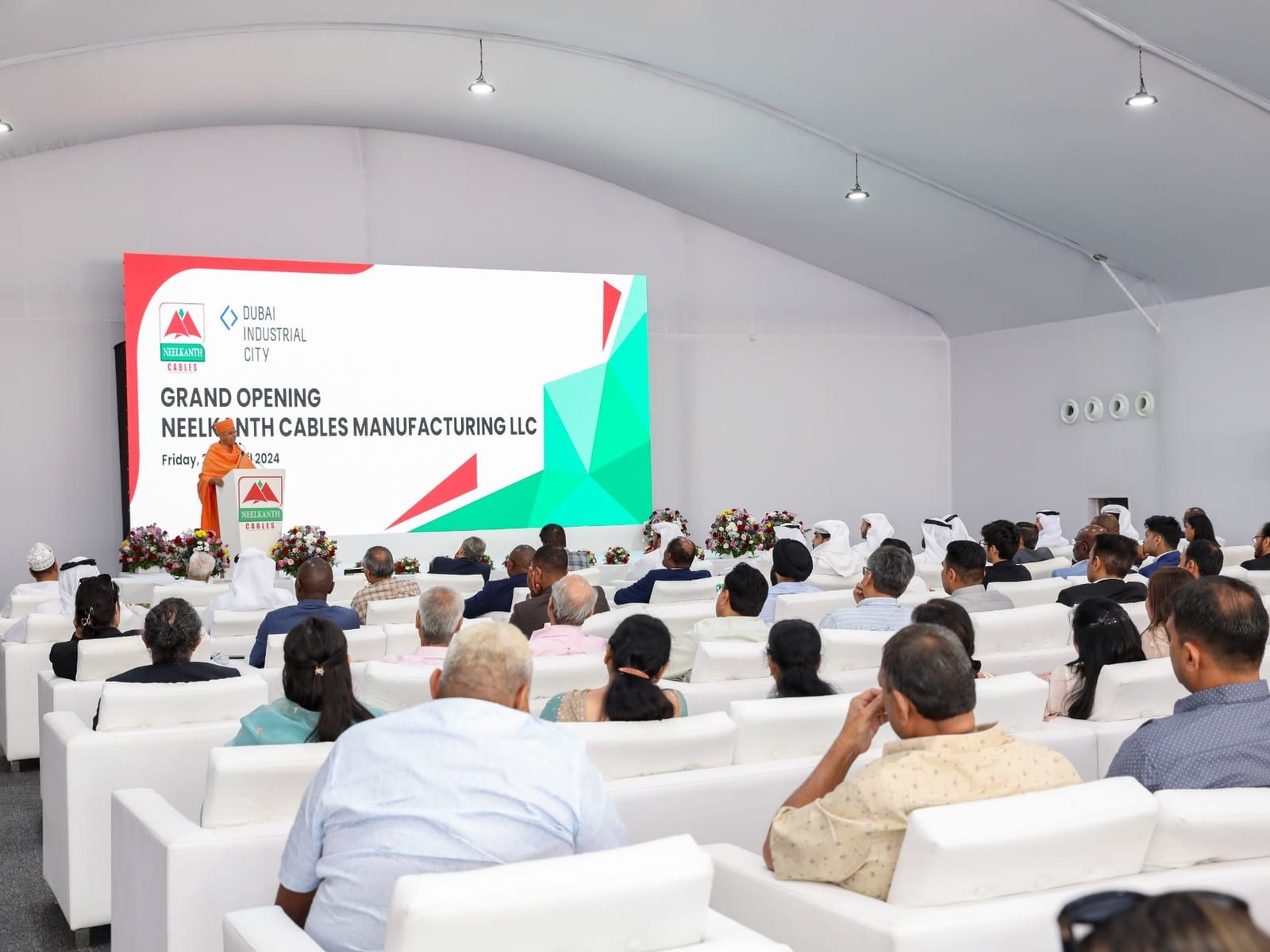 Guests seated in the tented venue at the Neelkanth Cables Manufacturing grand opening, Dubai Industrial City