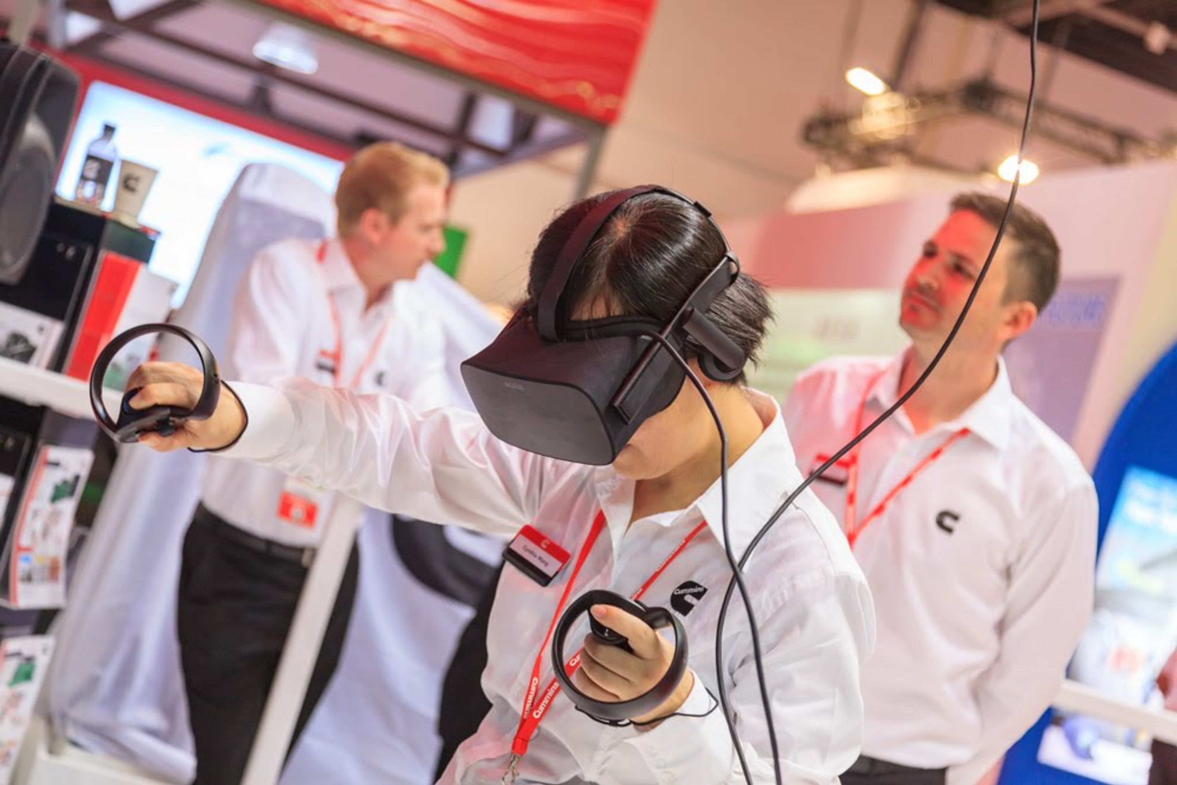 Close-up of a visitor interacting with a VR headset at an exhibition, demonstrating the use of cutting-edge technology to enhance the attendee experience