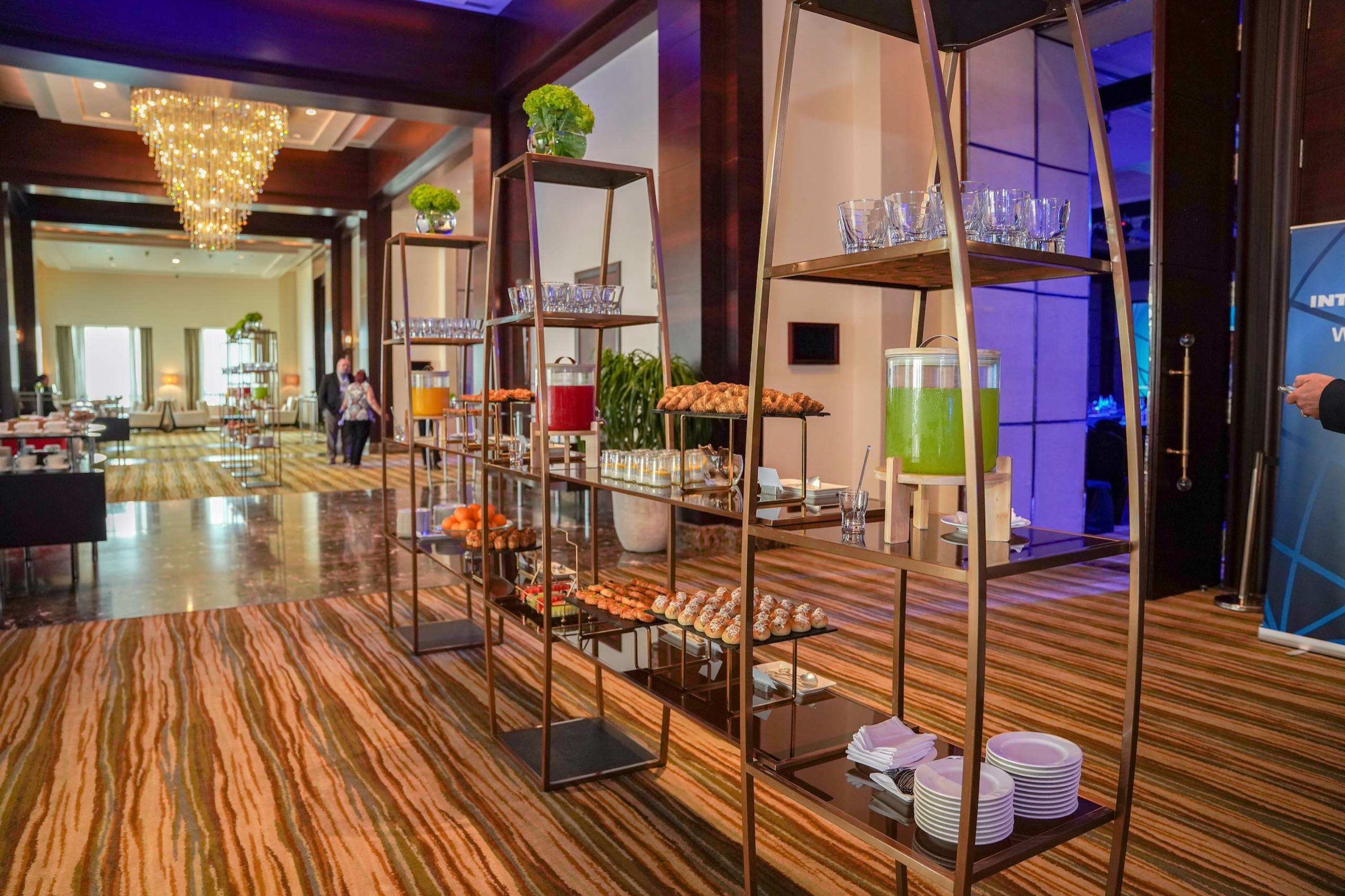 Outdoor terrace with shelving décor and lighting prepared for an event
