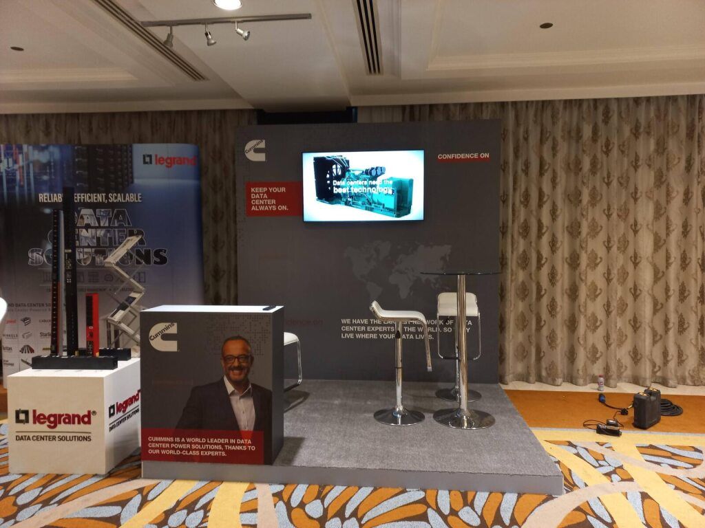 Exhibition stand with an engine display and branded screen