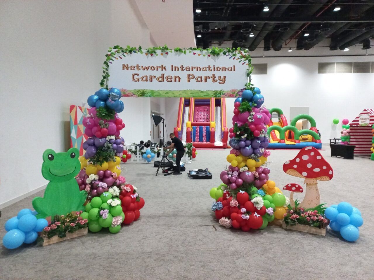 Balloon arch and garden-party décor at a school community event