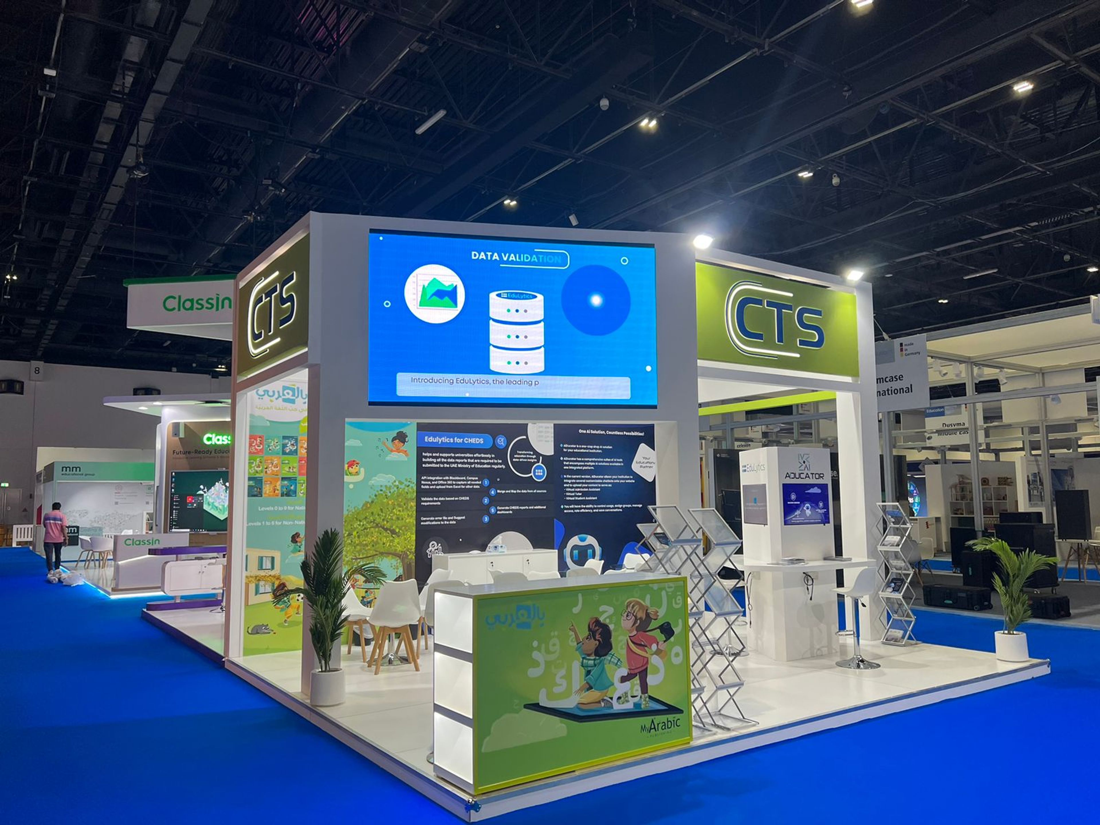 A sleek, modern exhibition stand featuring branded visuals, interactive displays, and product showcases designed to capture attention