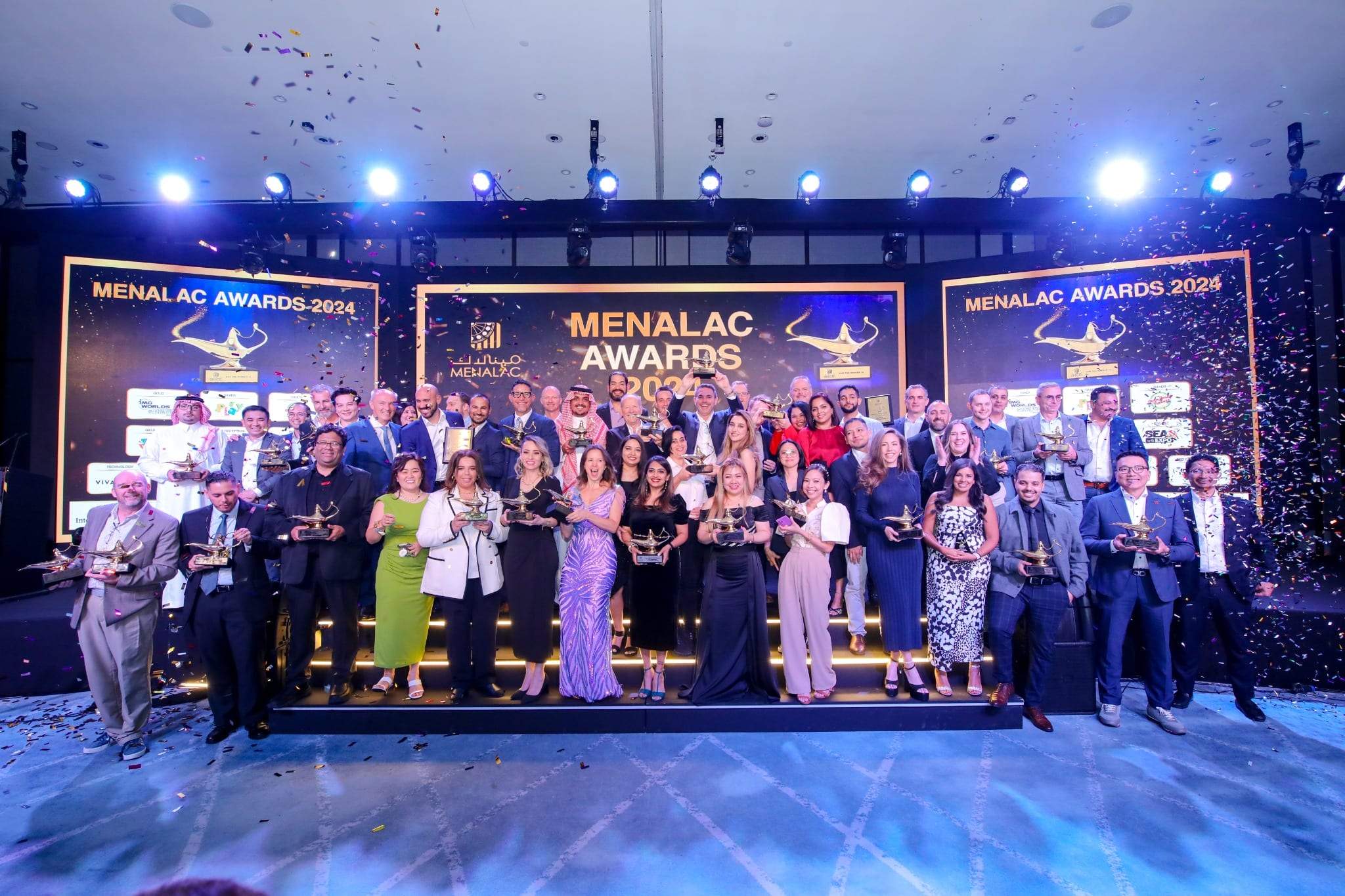 Winners on stage with confetti at the close of an awards gala