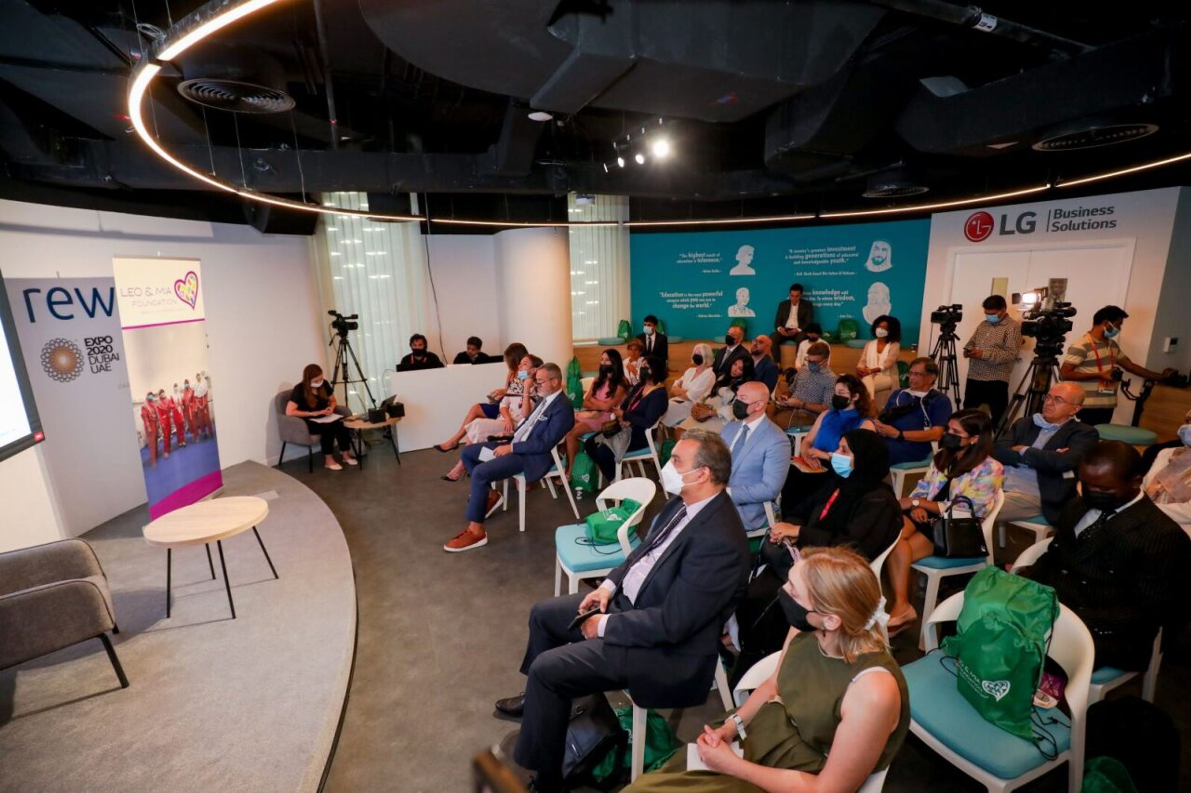 Audience listening to a panel discussion at a business conference