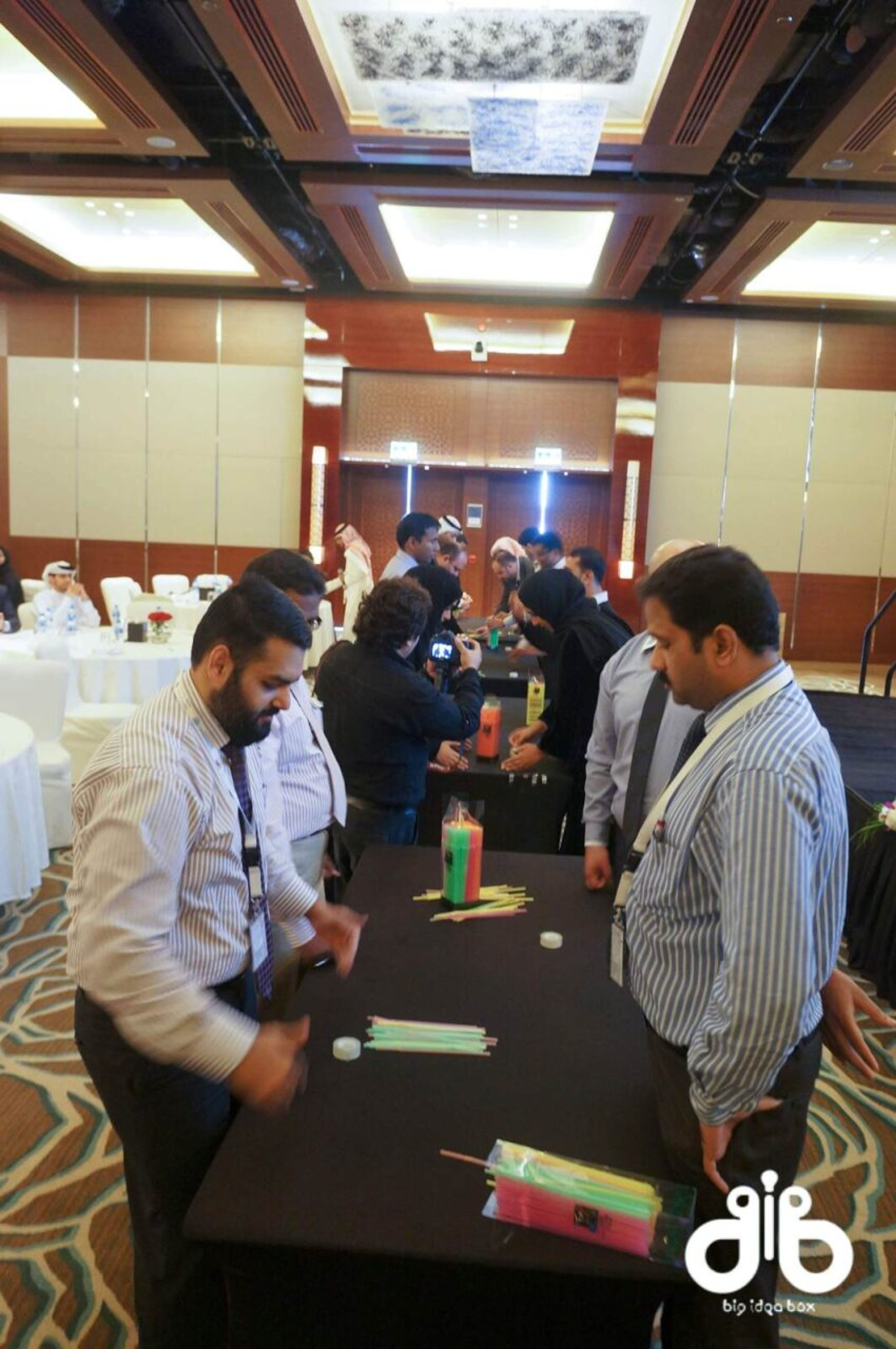 Guests networking around cocktail tables at a corporate event