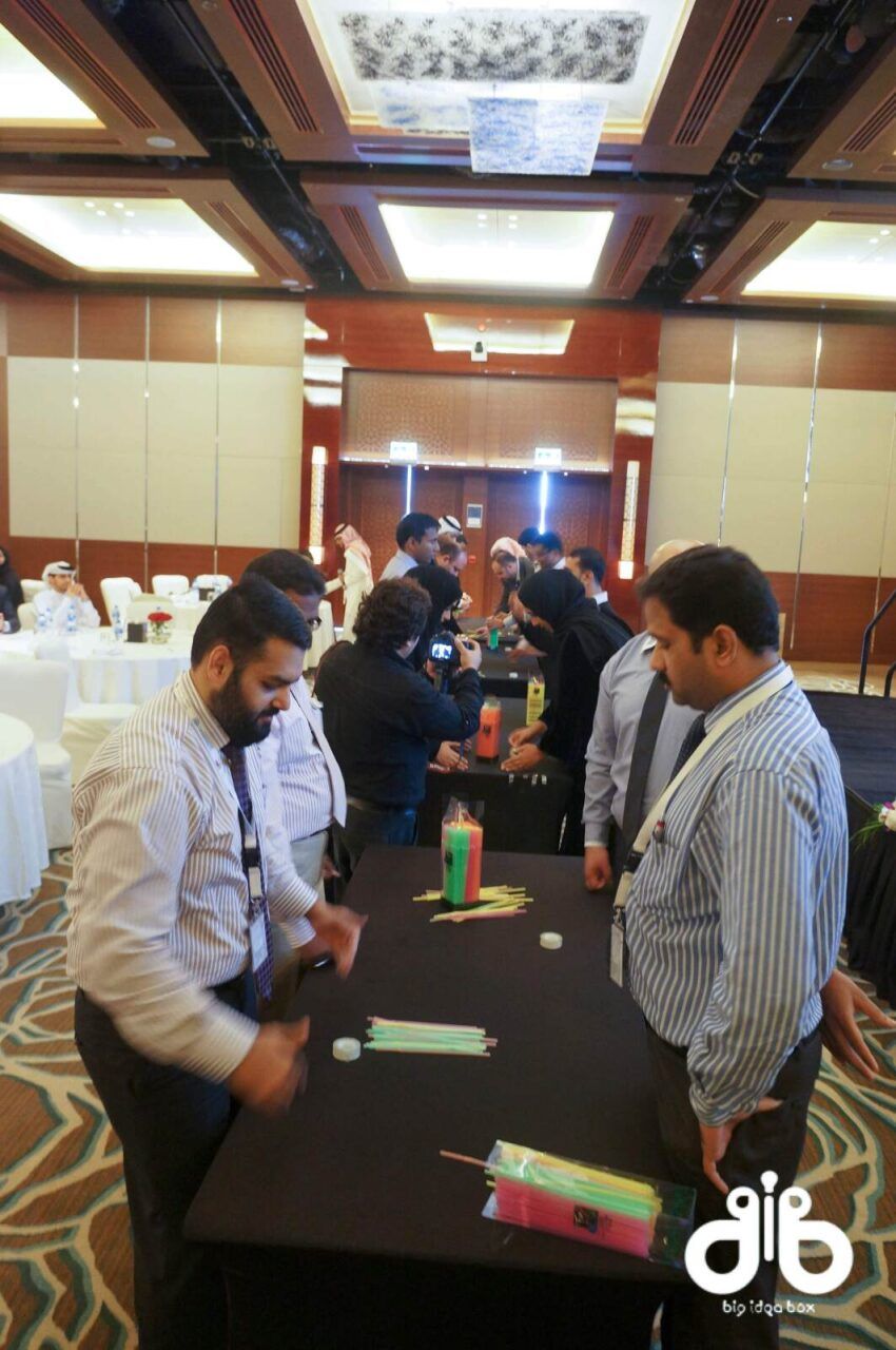 Guests networking around cocktail tables at a corporate event